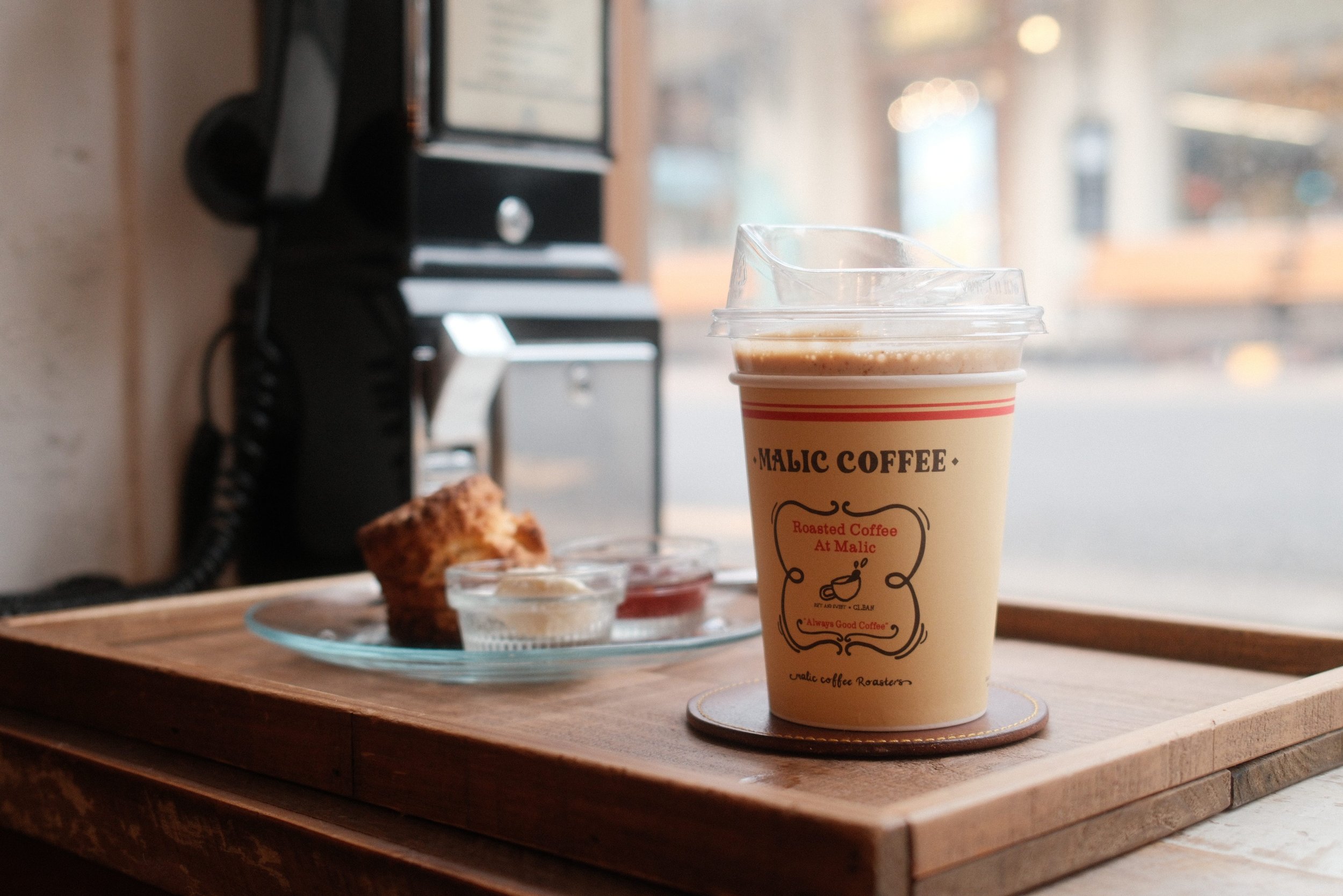 Coffee and scone with butter and jelly