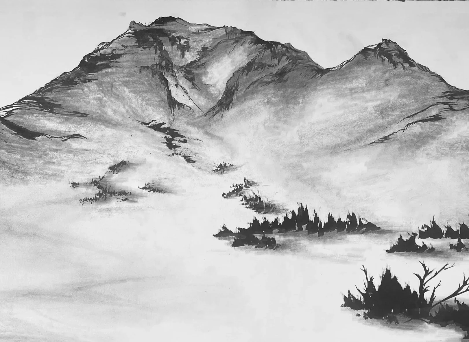 A traditional black and white landscape ink painting of mountains, mist, and trees.