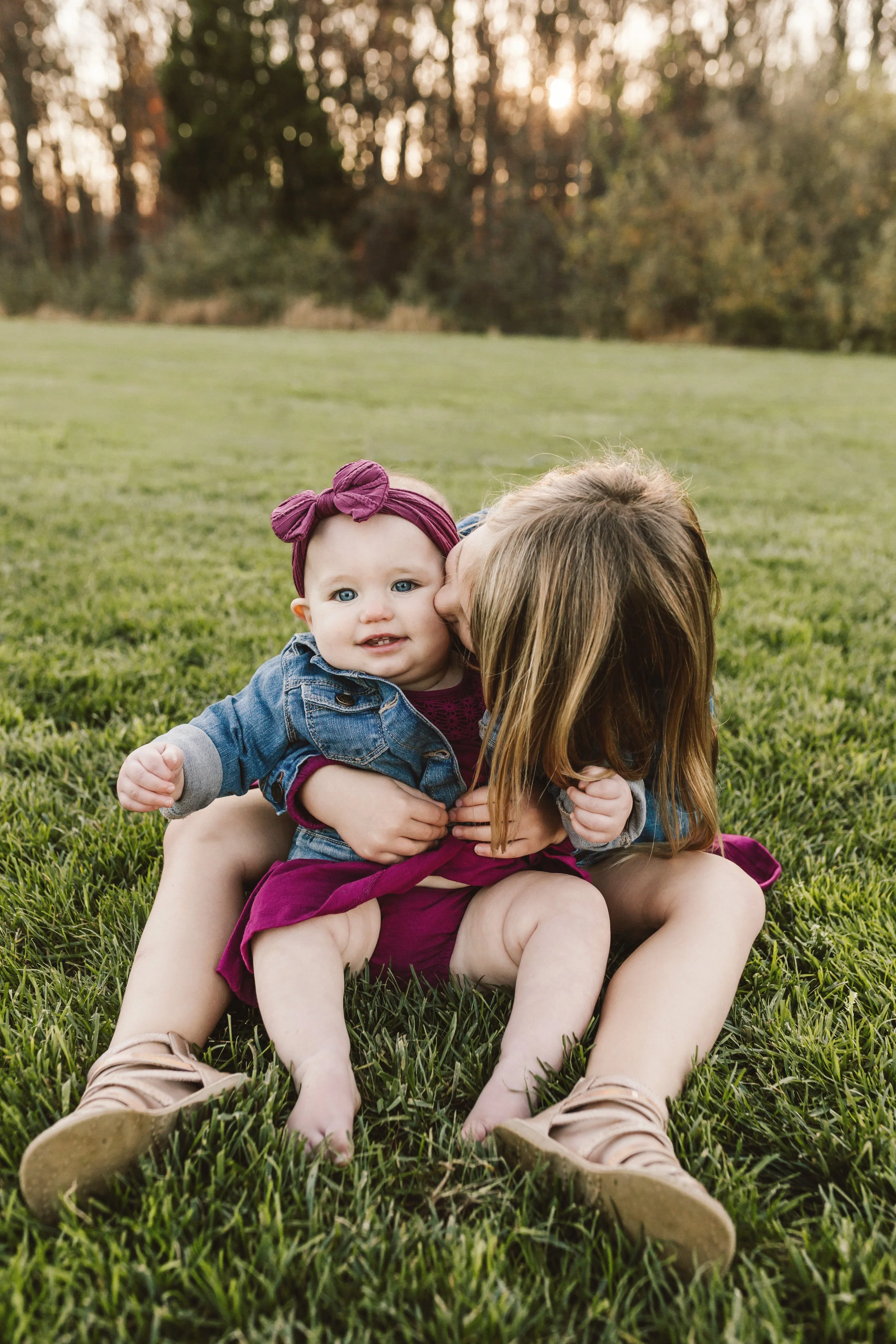 Children laughing naturally in playful outdoor family photos near Philadelphia parks
