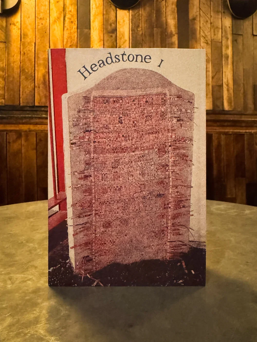 A picture of the Headstone Zine, which reads "Headstone 1" and includes a red image of a headstone in dirt.