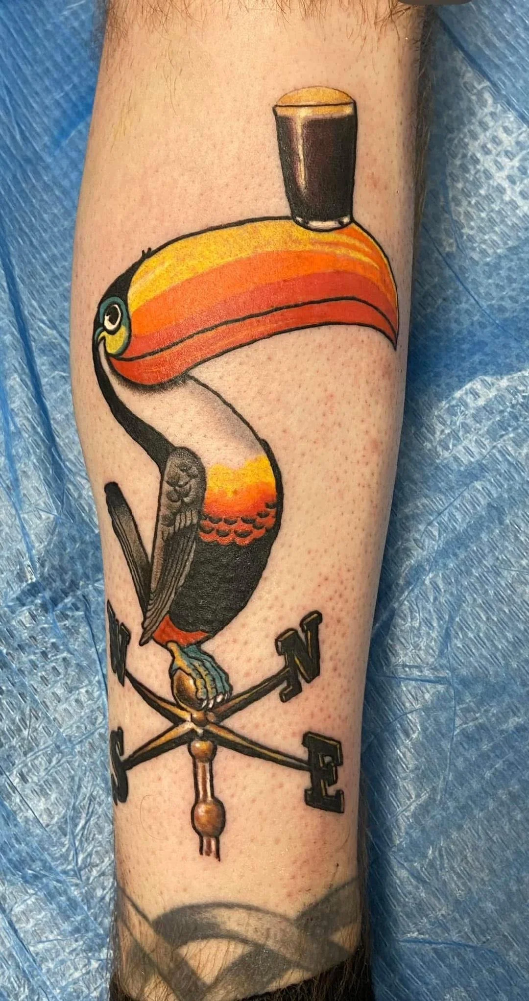 Illustrative Tattoo of a Vintage Guinness Beer Ad with a Toucan
