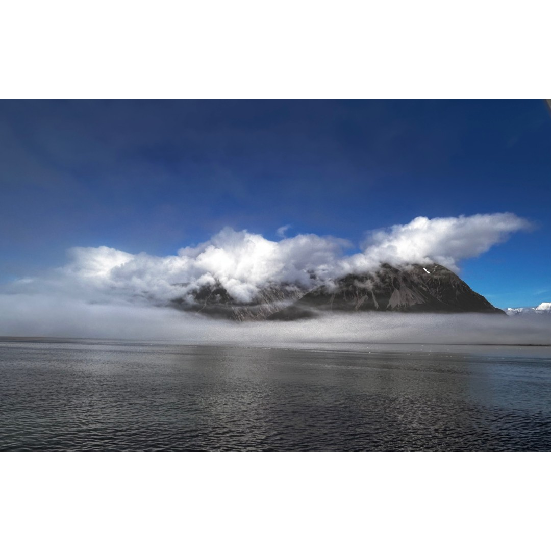 Primordial Fog Draping A Glacial Island.png