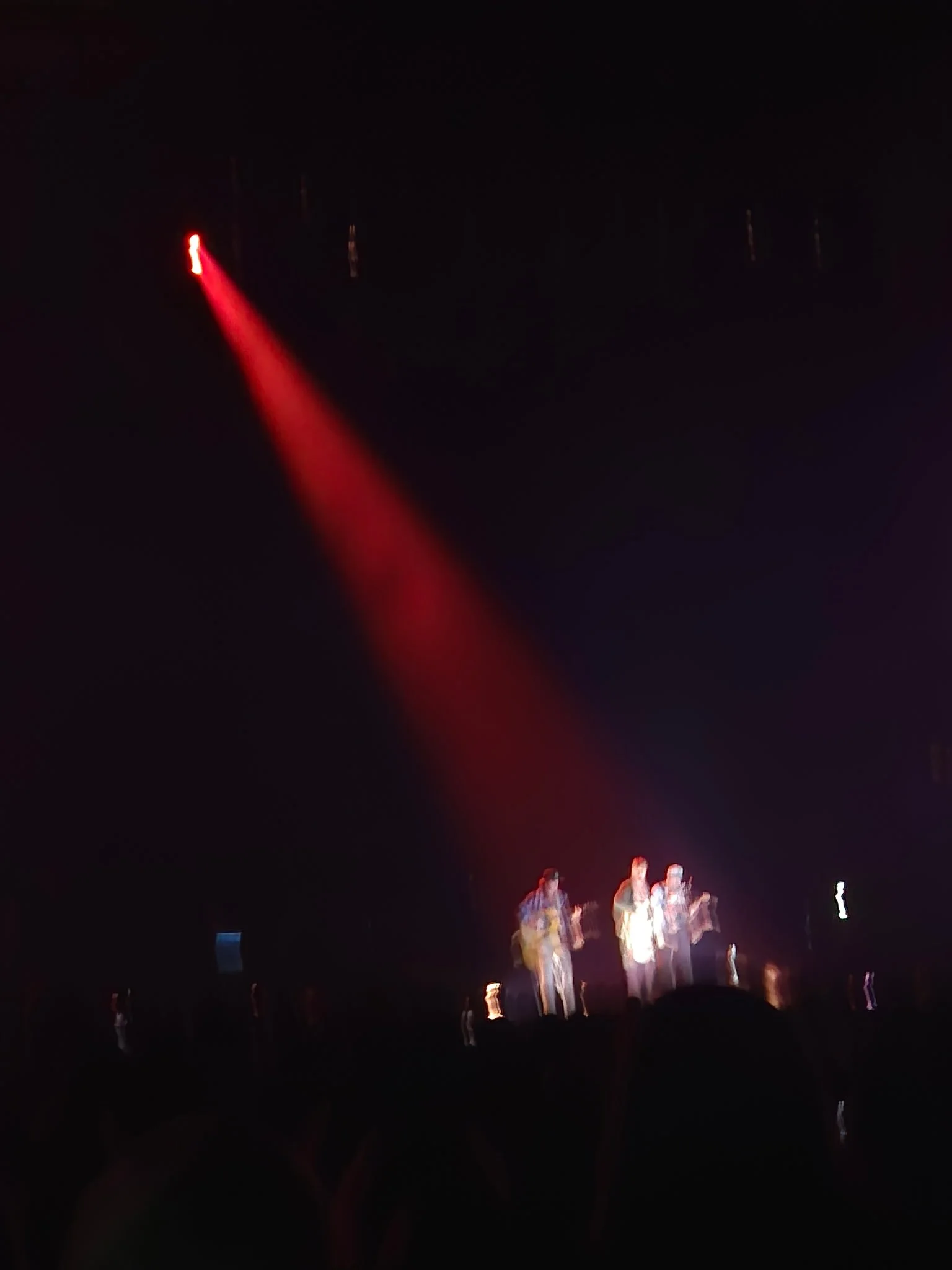 A blurry Tyler Childers, CJ Cain and Jesse Wells
