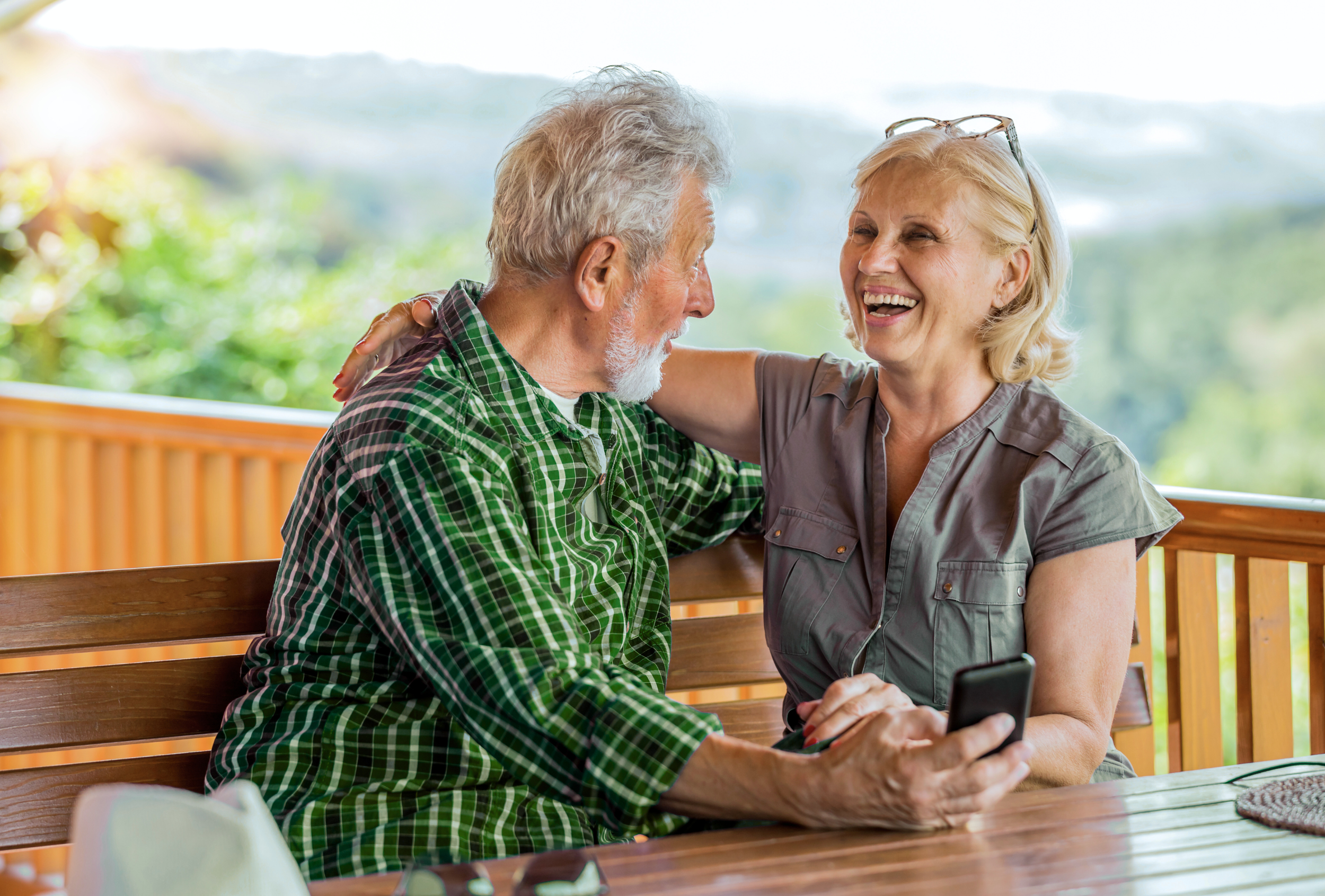 Happy senior retired couple who got a reverse mortgage in Canada. Reverse Mortgage Centre