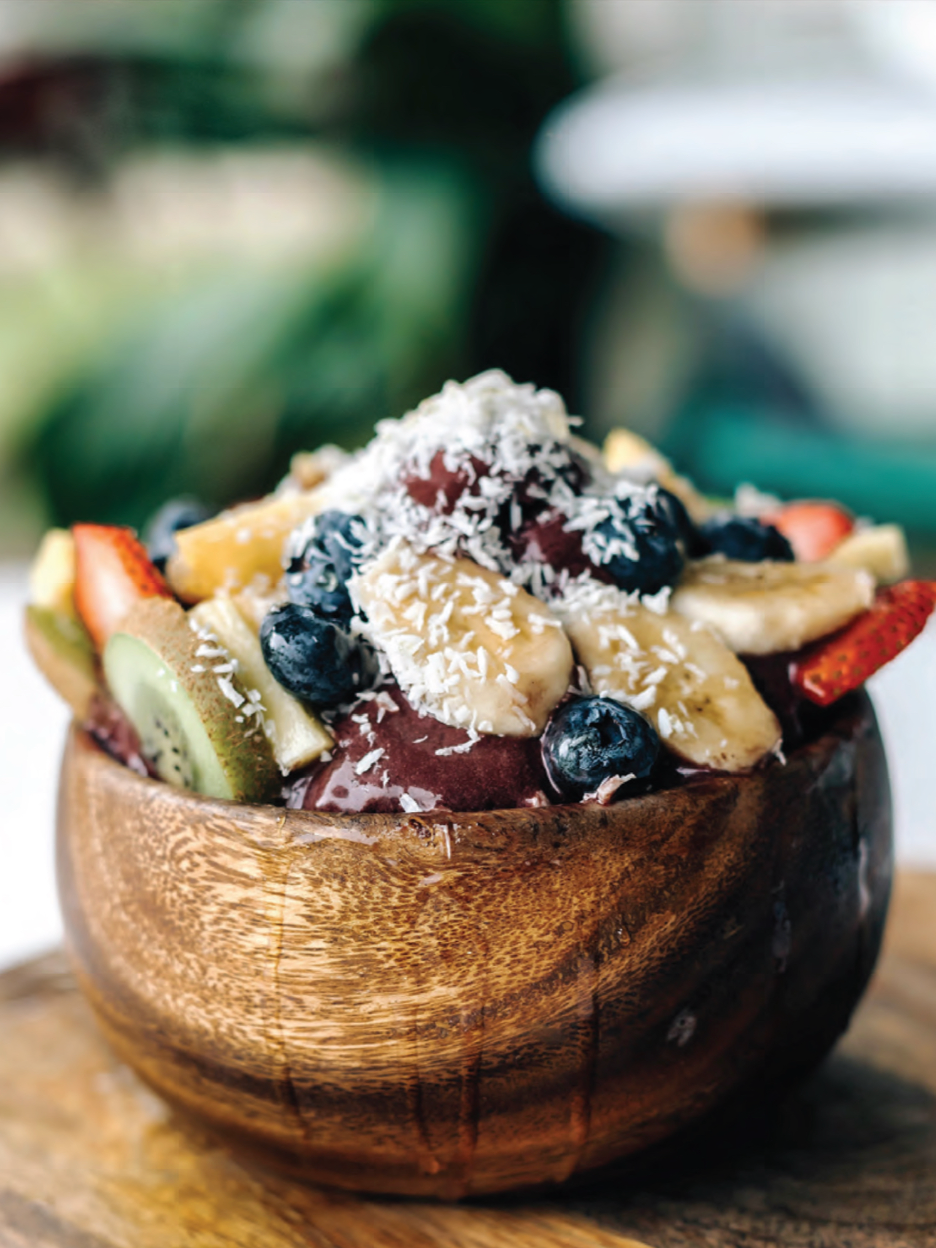 The Tropical Bowl, açaí topped with banana, strawberries, blueberries and coconut