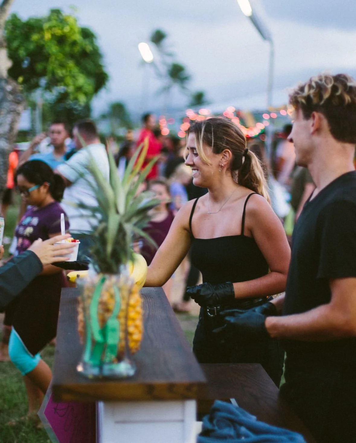 The Little Açaí Cart serving fresh açaí bowls to guests at an event