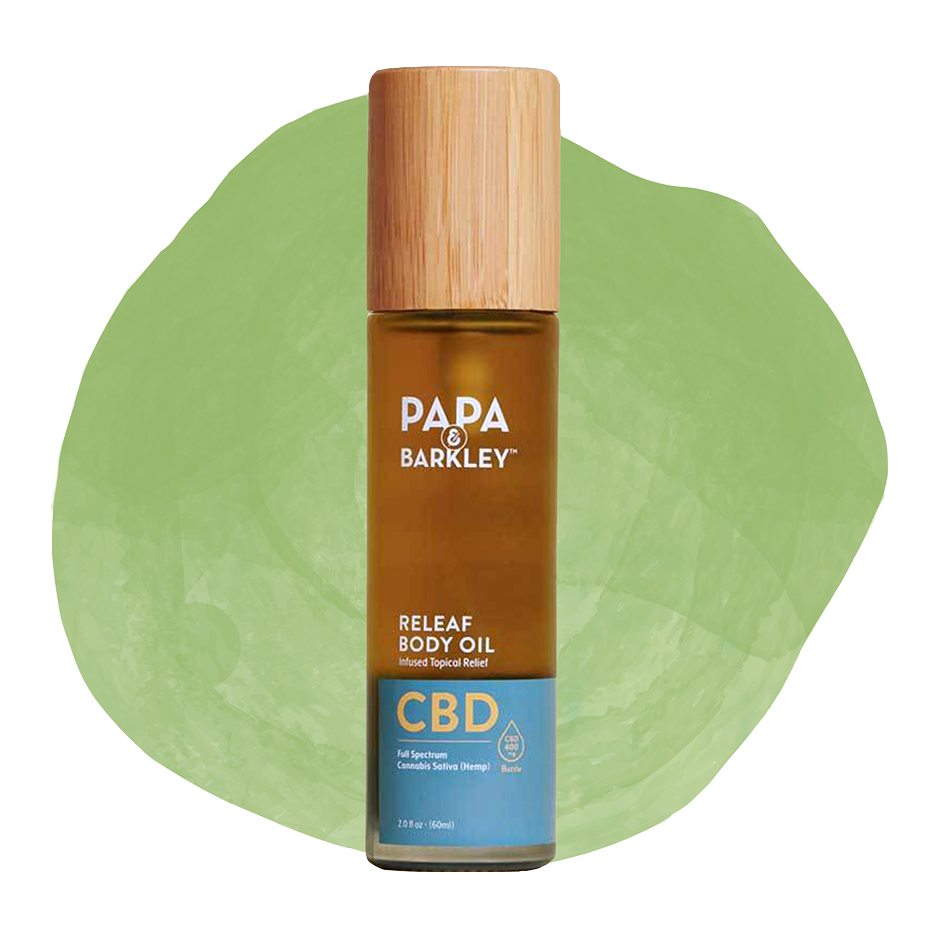 Bottle of Papa & Barkley Releaf Body Oil with CBD, placed against a green background.