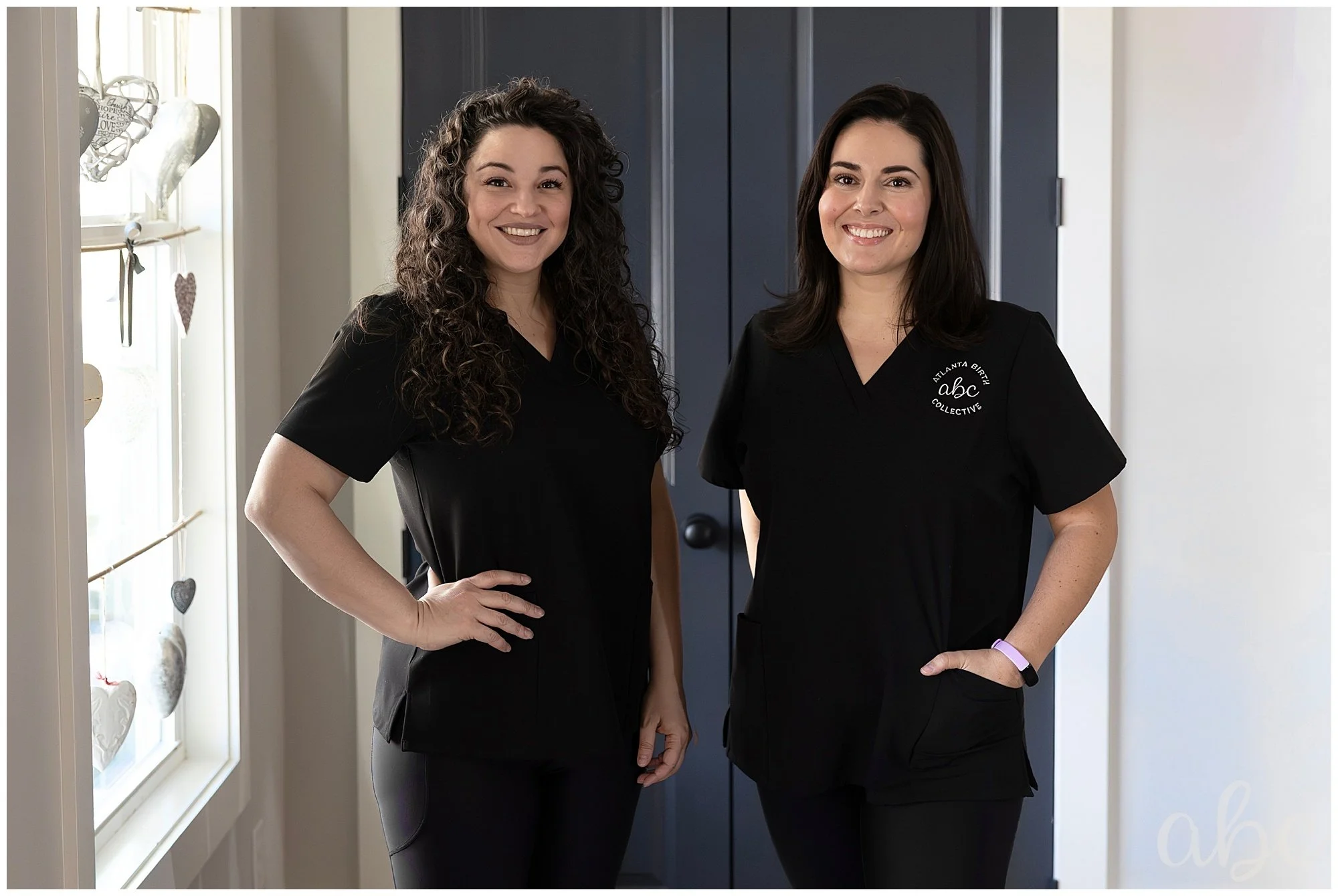 Atlanta Birth Collective Doula Photographers Maegan and Milene standing in uniform