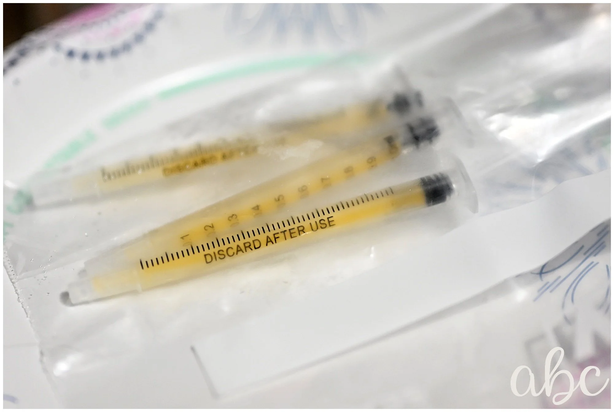 Ziplock bag of colostrum syringes. Photo by Canton Woodstock Photographer and doula Maegan Hall