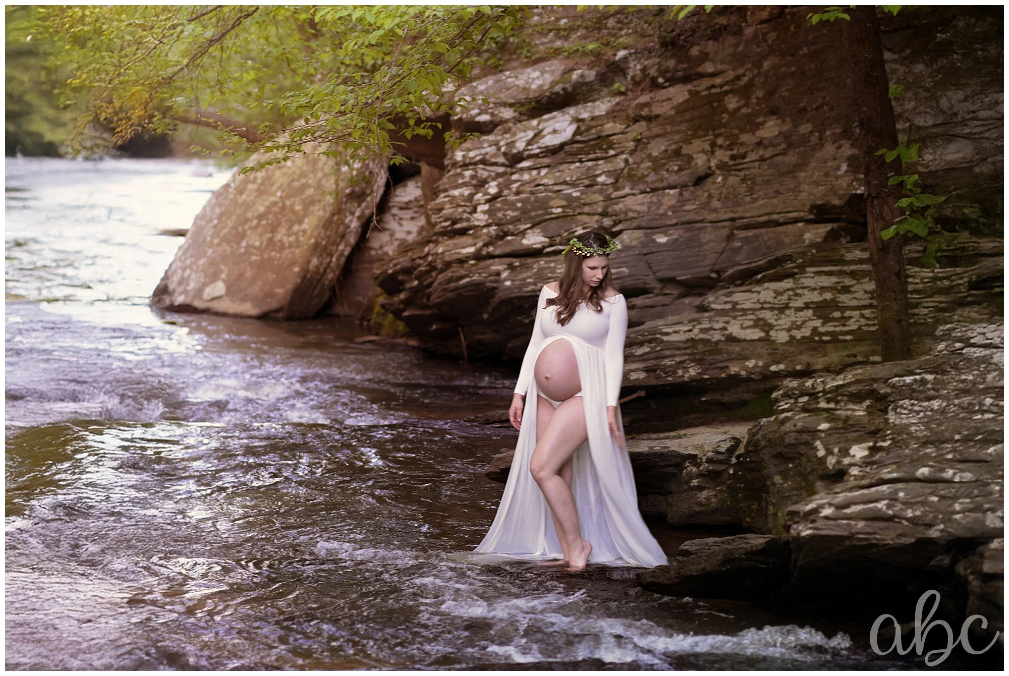 Pregnant mother poses in the creek in Marietta GA