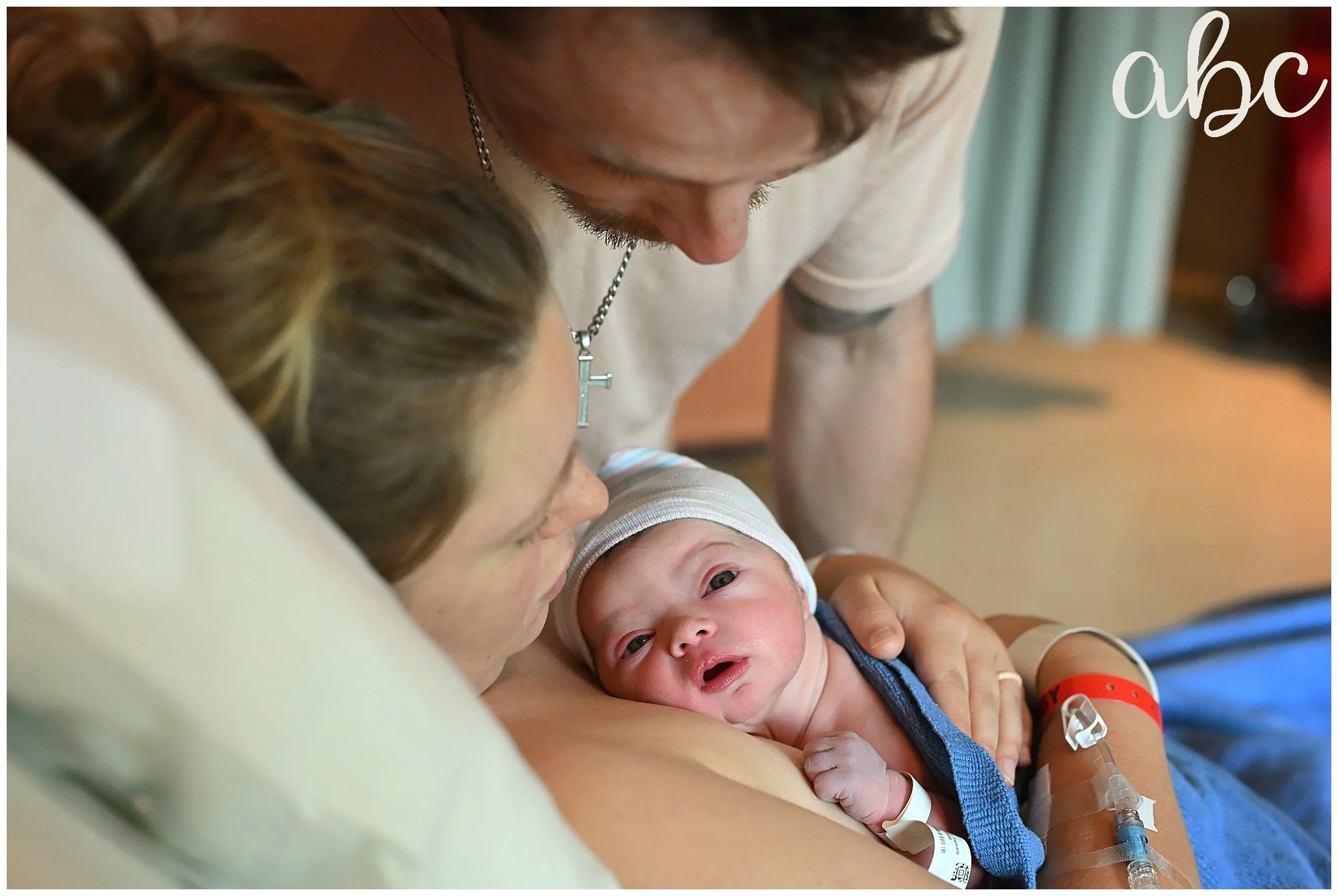Mom enjoying skin-to-skin in hospital bed after VBAC