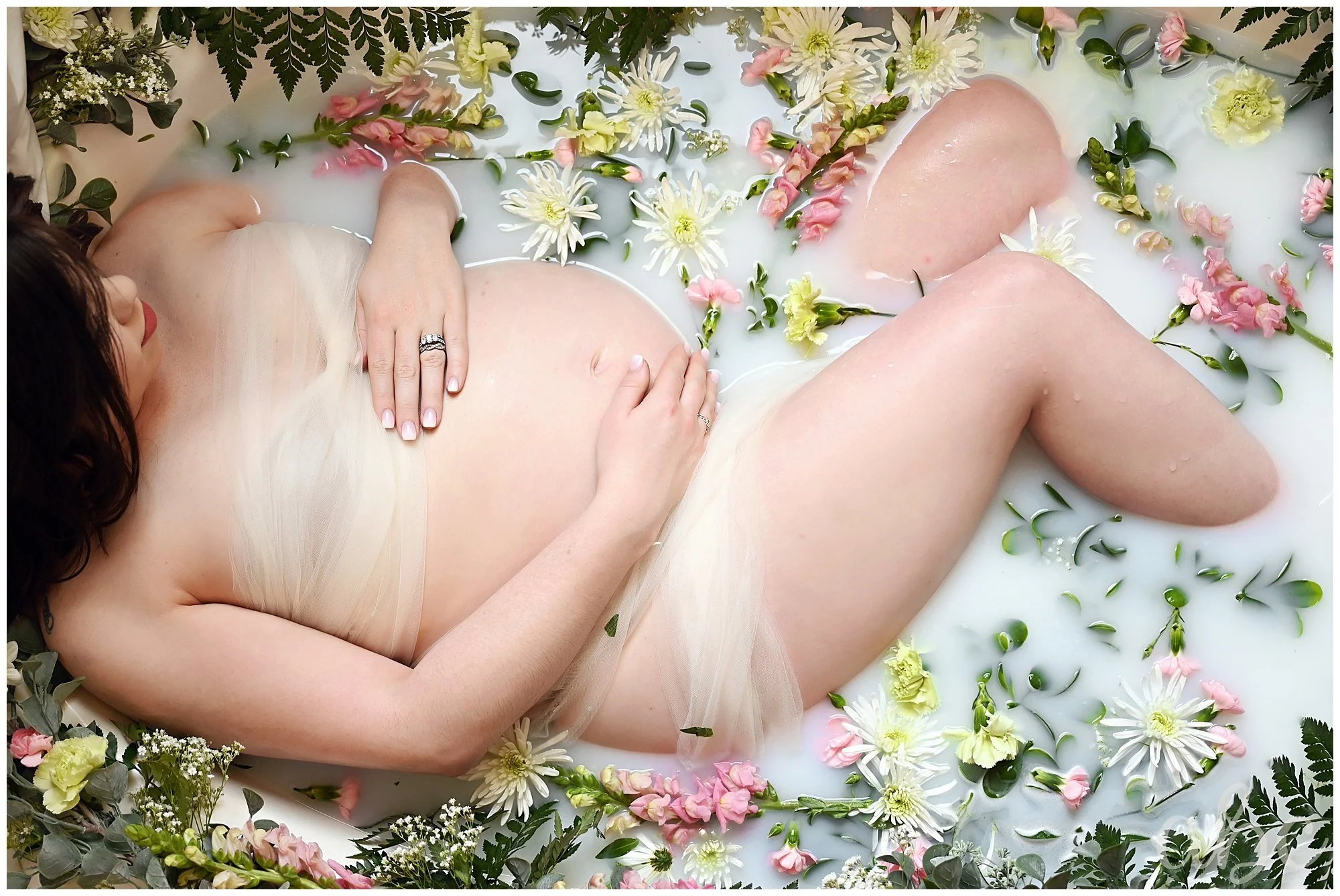 Atlanta maternity photographer captures expectant mother in floral milk bath
