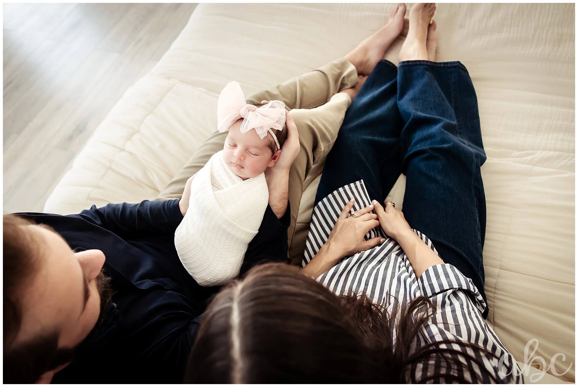 Woodstock doula photographer captures parents gazing at their newborn baby girl