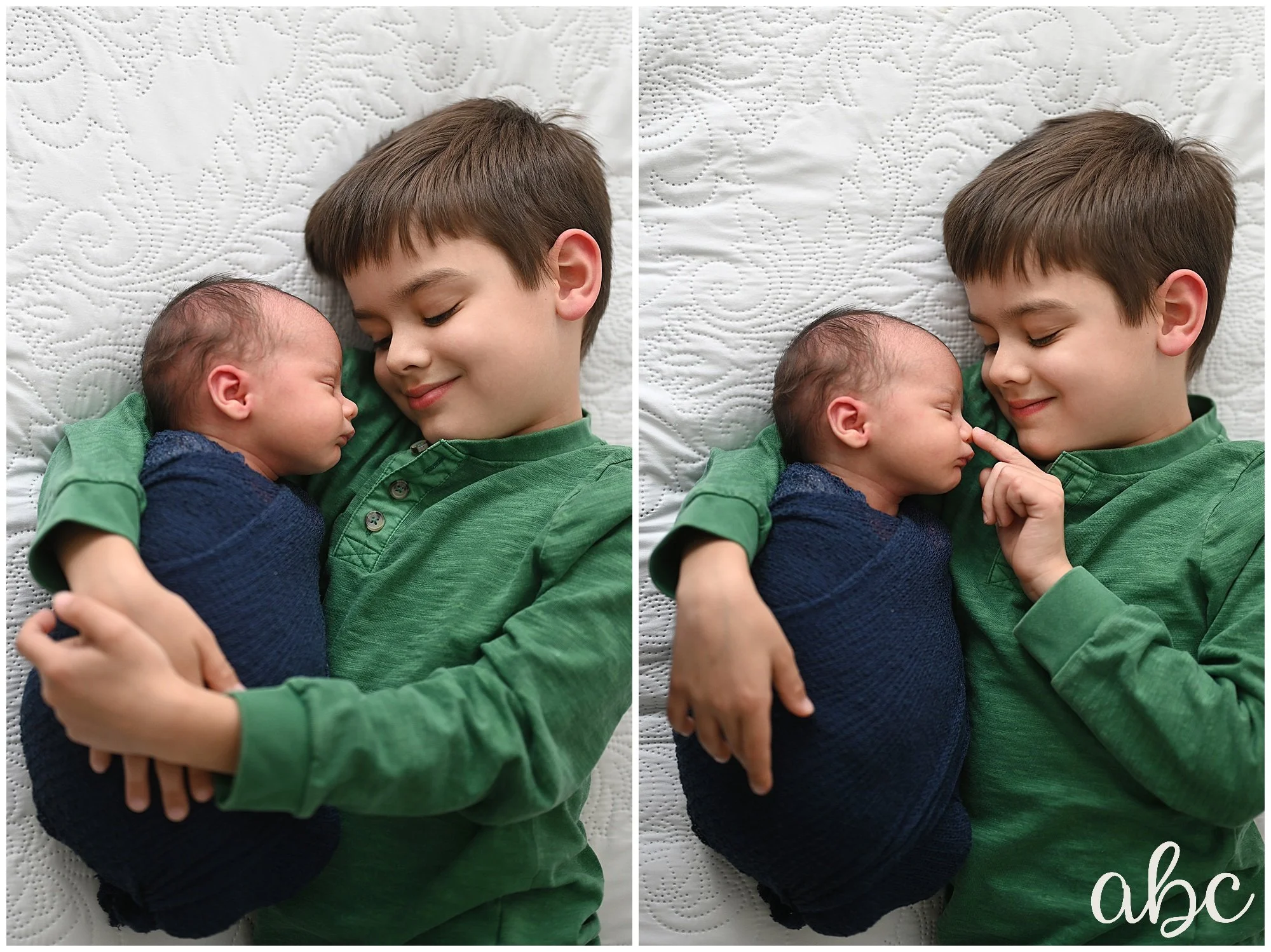 Big brother smiles at his newborn baby brother. Photo by Roswell Doula Photographer