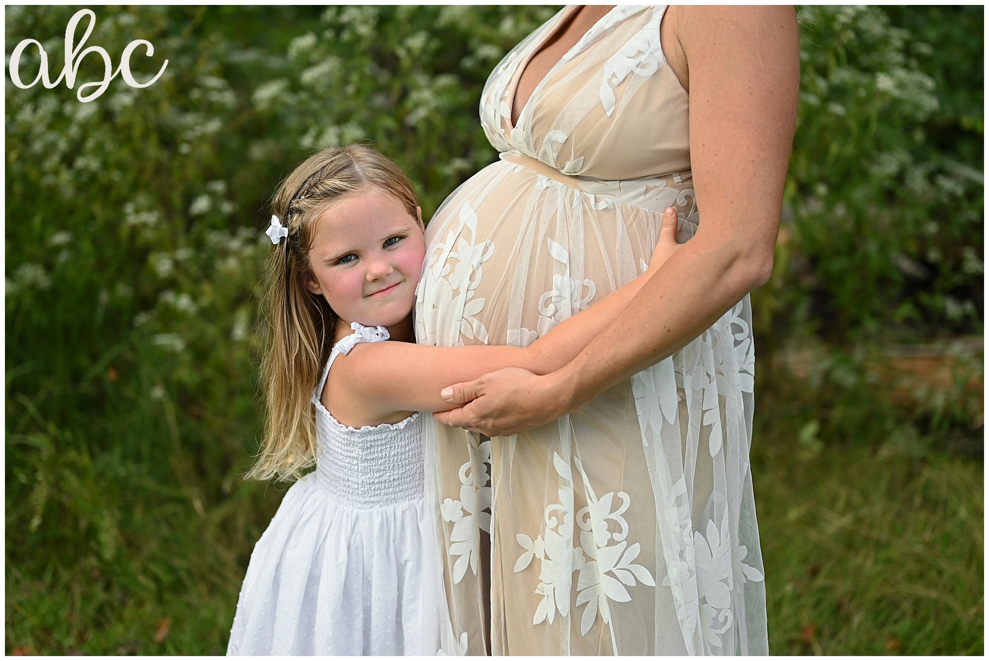 Roswell Doula Photographer Maegan Hall takes maternity photos of client and daughter