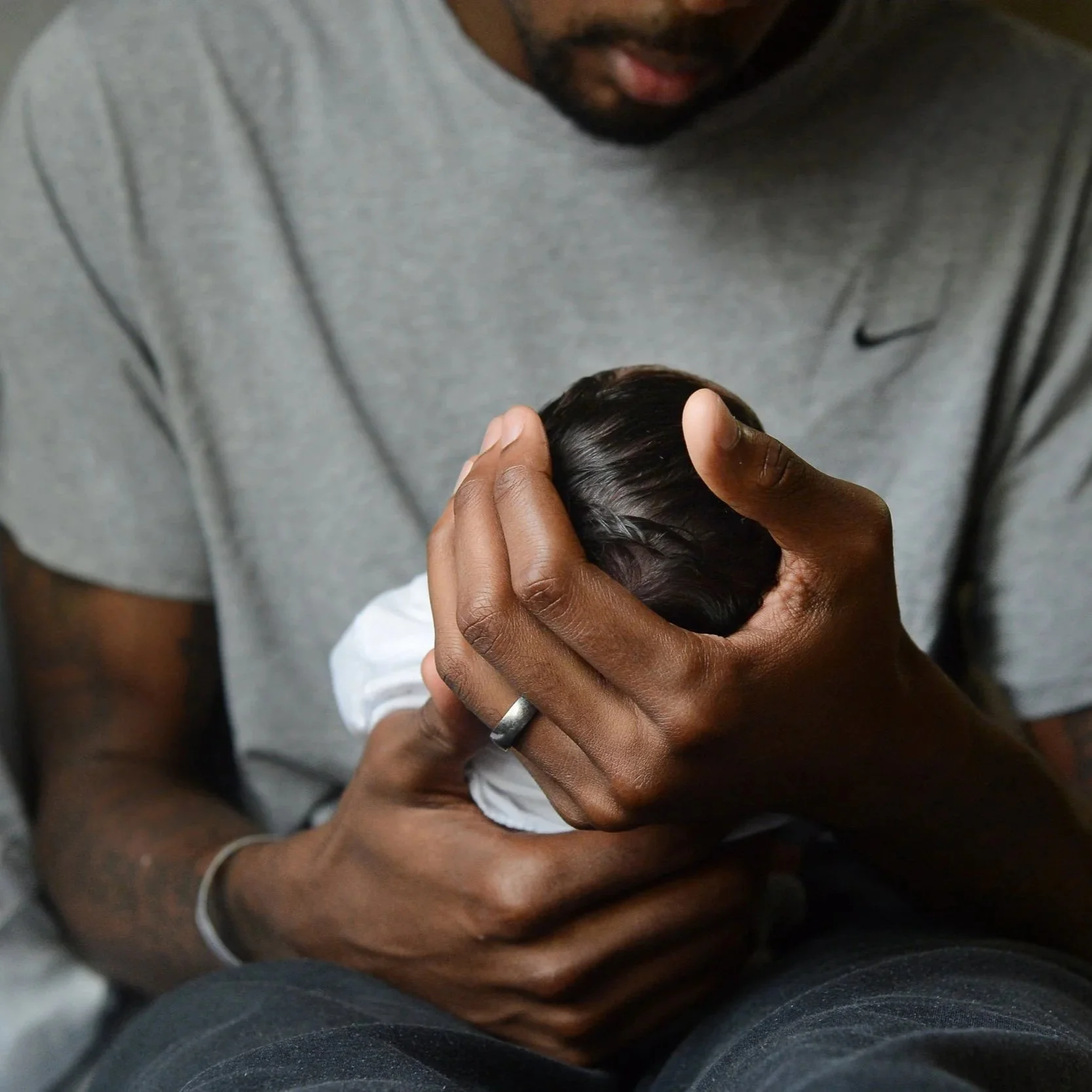 A lifestyle photo of a new parent and baby, representing postpartum support in Atlanta.