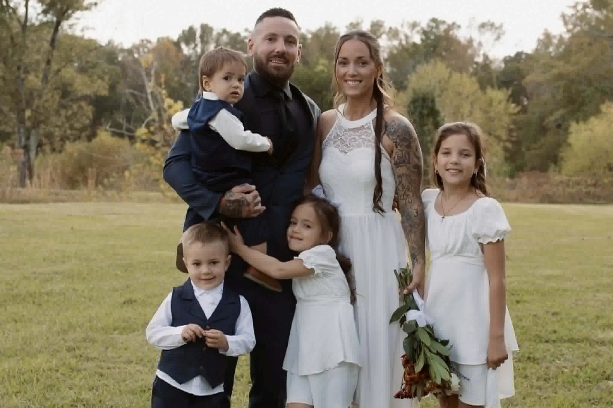 Woodstock Doula Photographer Koko poses with her 4 children and husband.