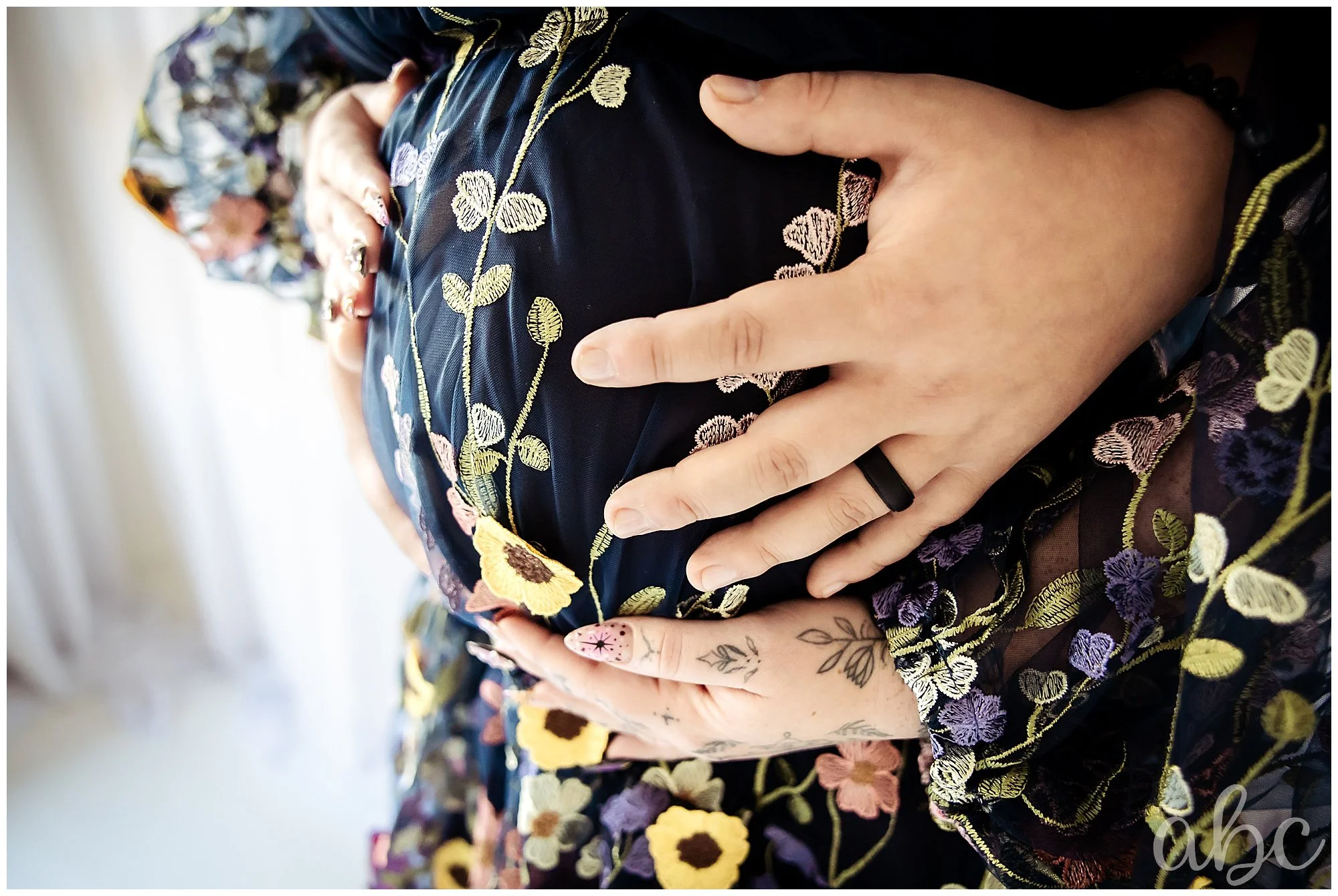 Mom and dad hug her pregnant belly with Woodstock doula photographer