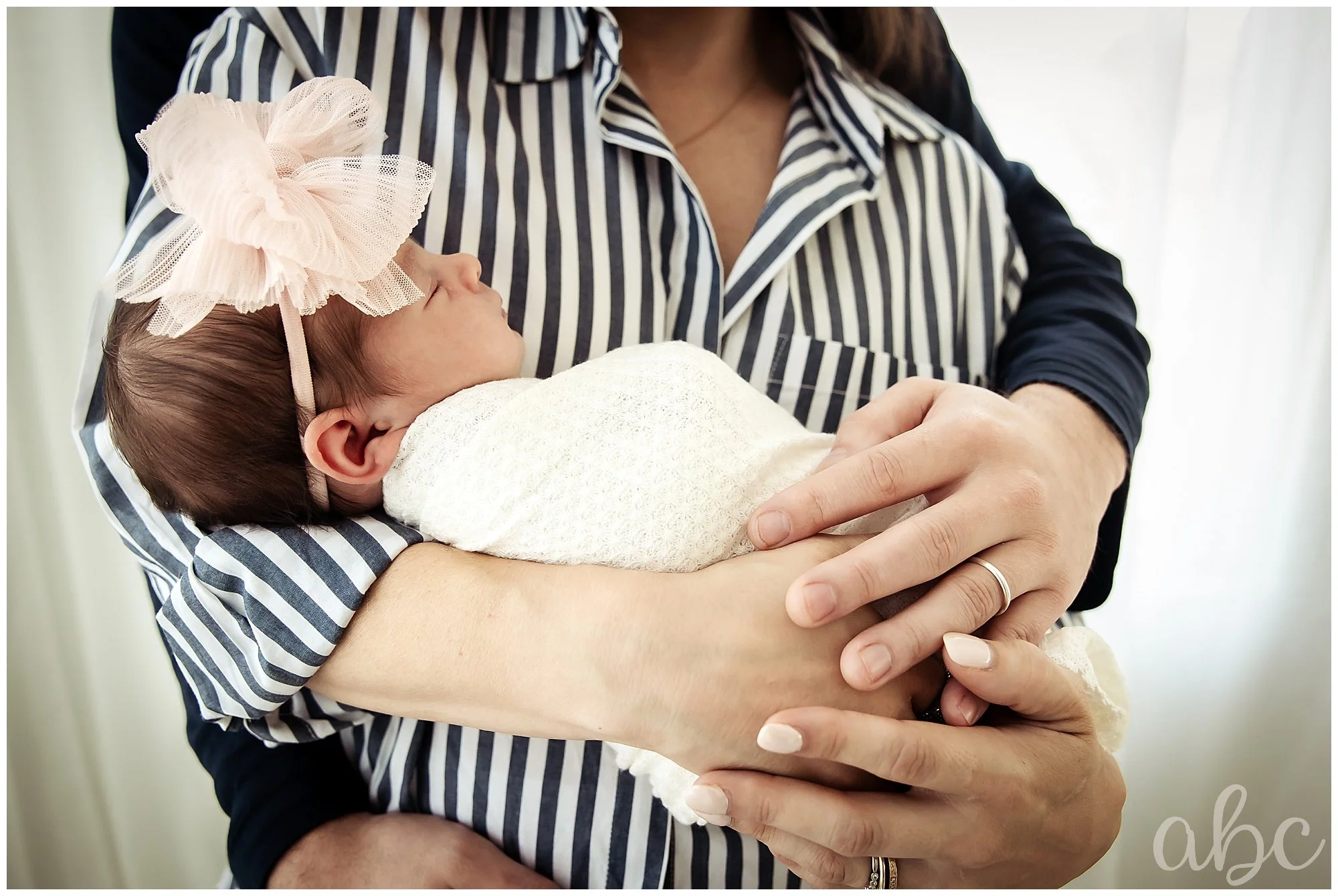Father hugs both wife and baby with Woostock Doula photographer
