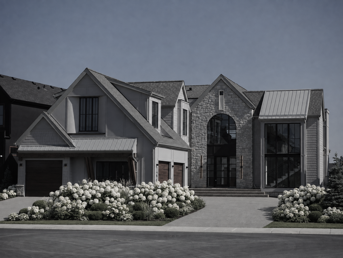 Traditional style Watermark at Bearspaw showhome backing onto the pond, featuring classic architectural detailing — designed by THAD.