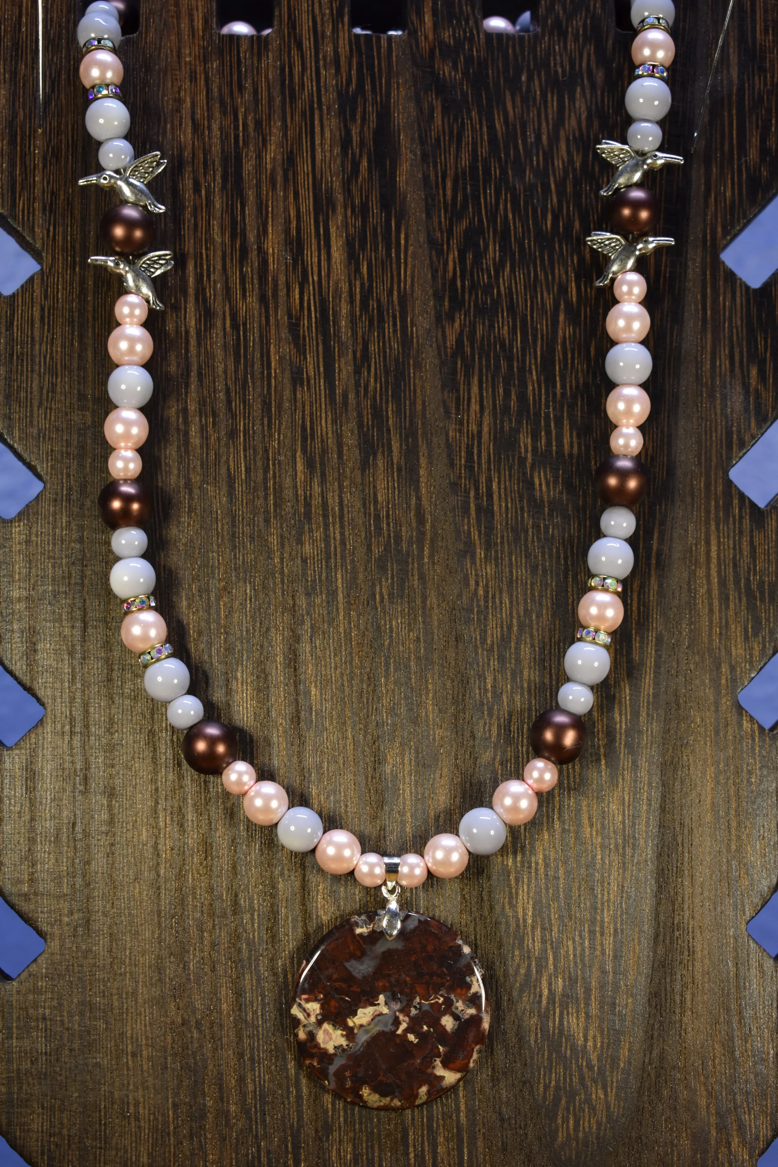 Agate pendant with glass and ceramic beads and hummingbird spacers