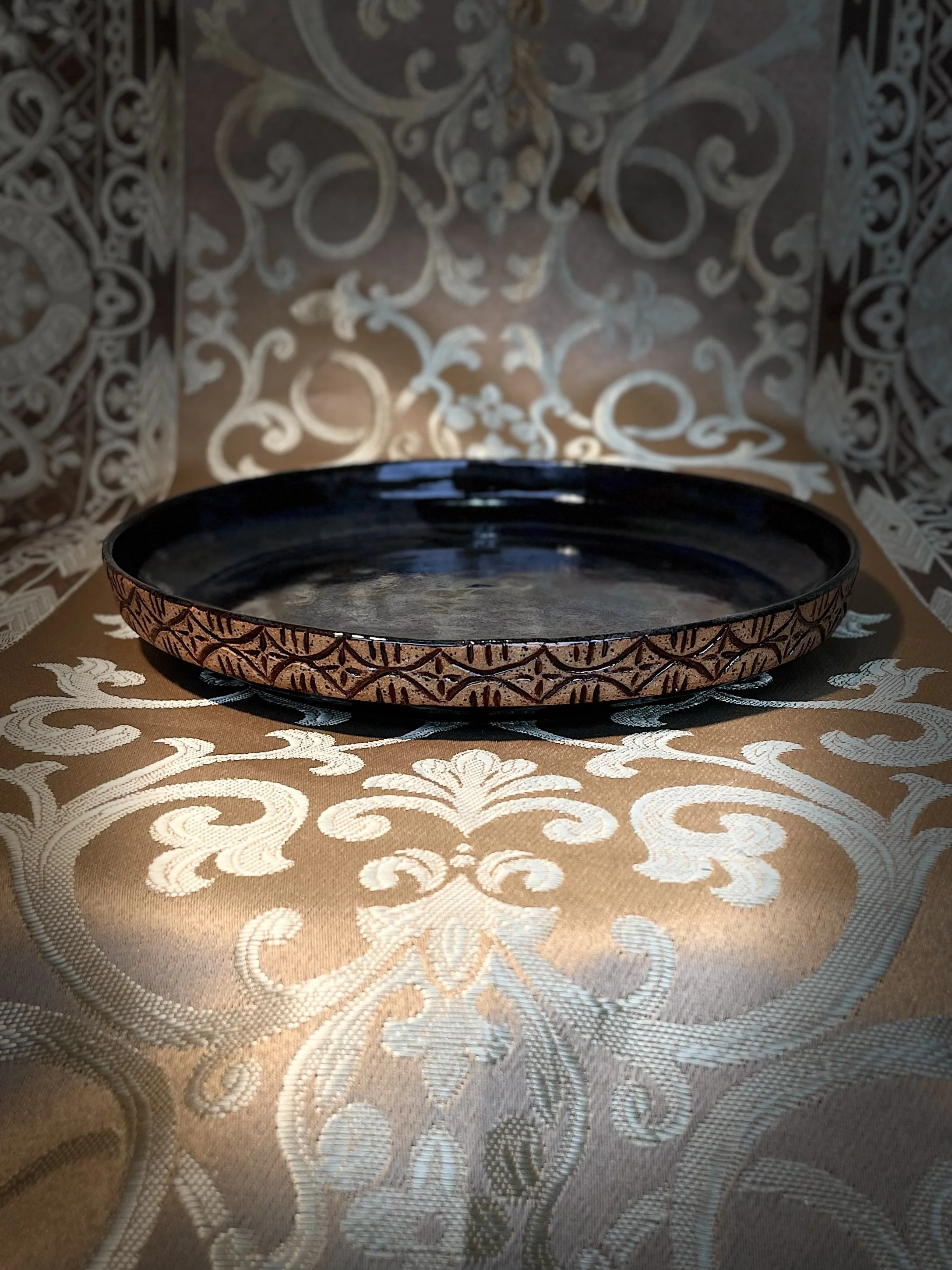 Earth Tone Glaze Ceramic Plate with Carved Design