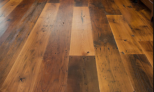 Close-up of a wooden hardwood floor with various shades of brown.