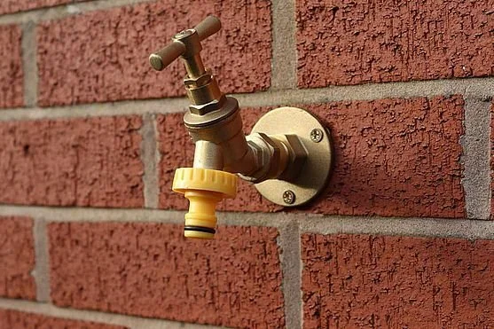 New outdoor tap fitted by Havering Heating, serving Havering, Romford, Hornchurch, Rainham, Upminster, and Essex. Expert plumbing services for garden taps, exterior water connections, and home improvements.