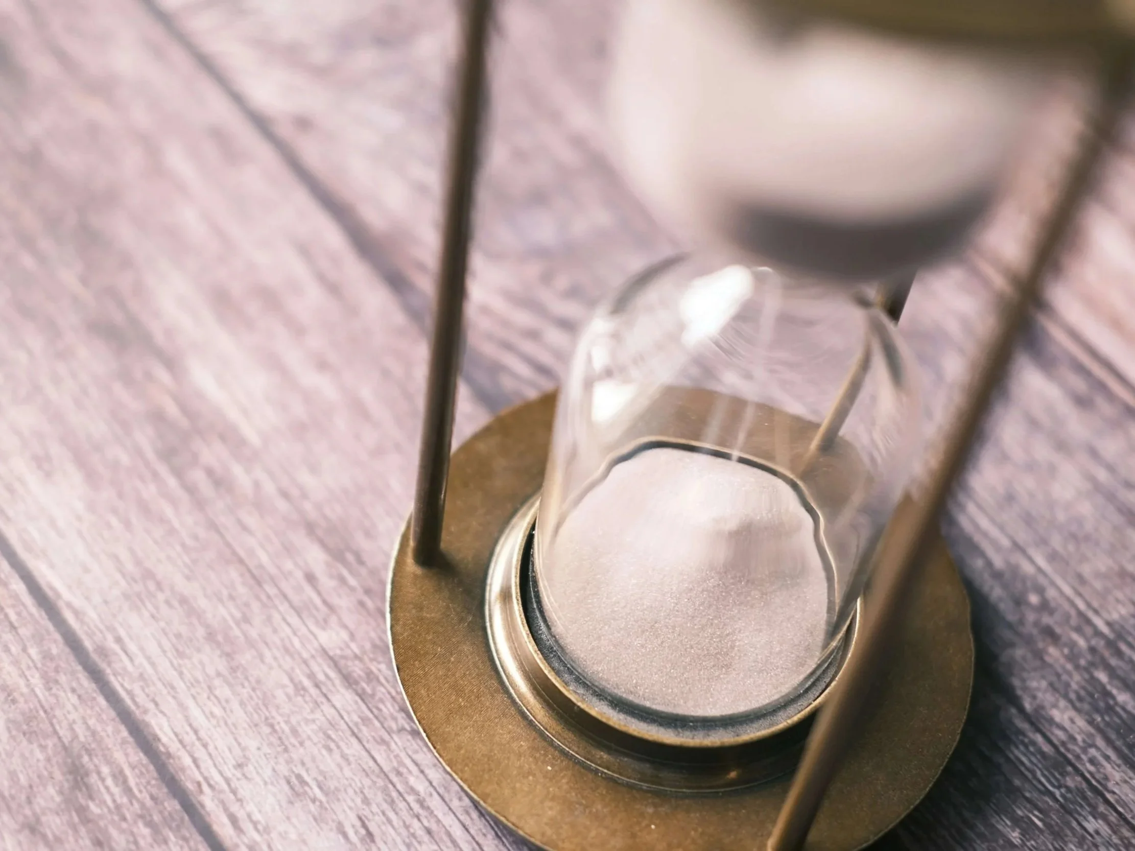 Hourglass with sand — representing the timeline of trauma therapy and what determines how long healing takes