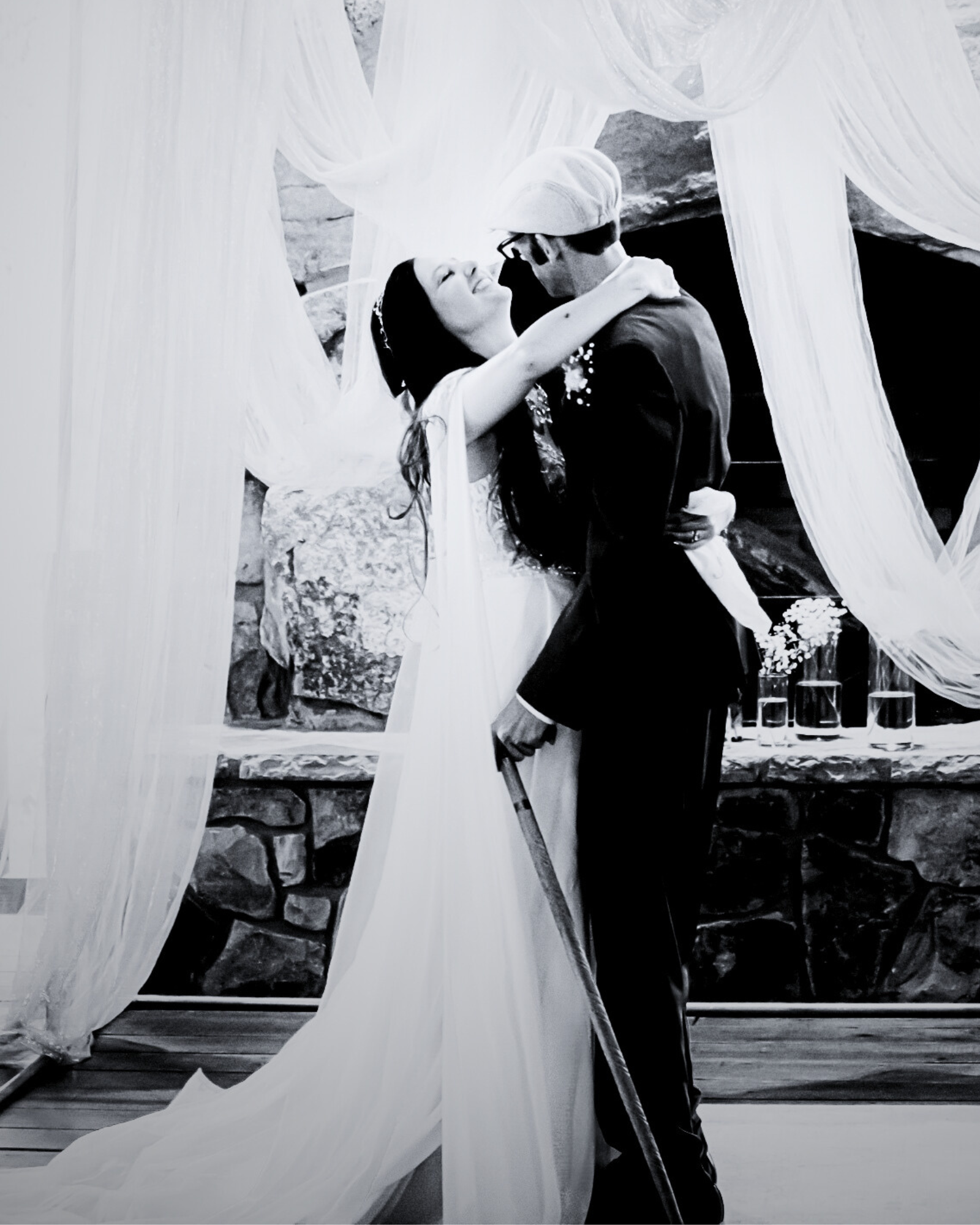 Meagan embracing her husband at their wedding ceremony