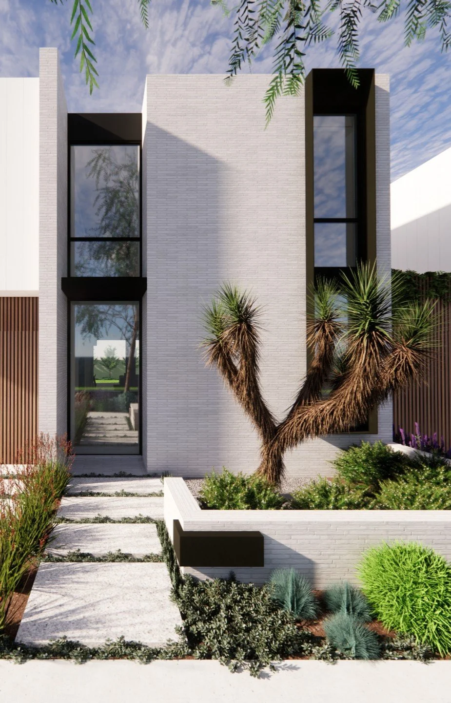 Modern two-story house with white brick exterior, tall narrow windows with black frames, desert landscaping, and a mature Joshua tree in front.