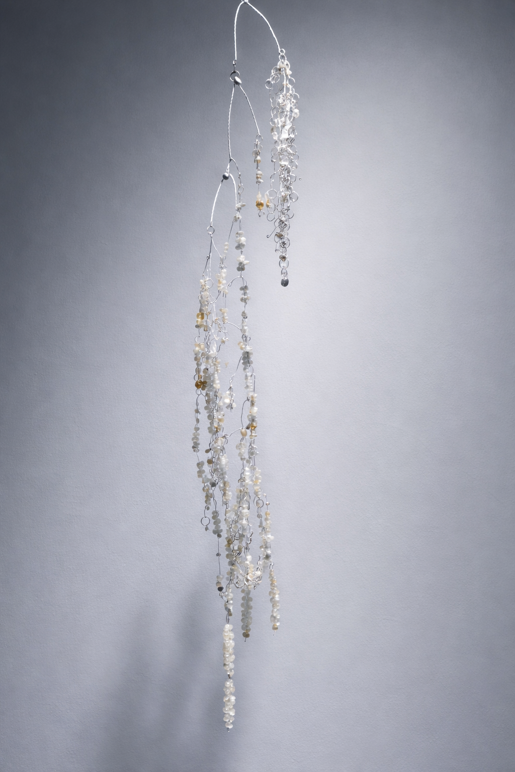 Where the lake was (detail) 2025 -ongoing, copper wire, aluminium wire, stone, light, variable dimensions