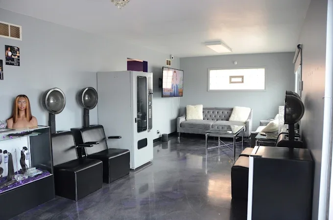 Kreations by Kashell salon in Lansing, Illinois, and Chicagoland with waiting room area including a vending machine, TV, sofas, magazines, and more.
