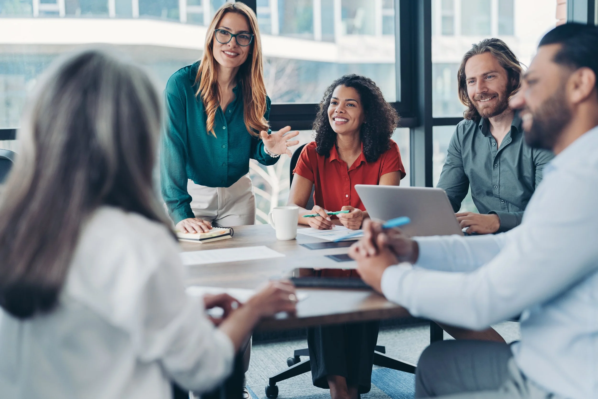 Group of work colleagues offering supporting each other during a work session