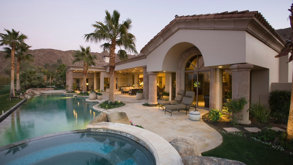 Twilight view of a Las Vegas estate with a pool