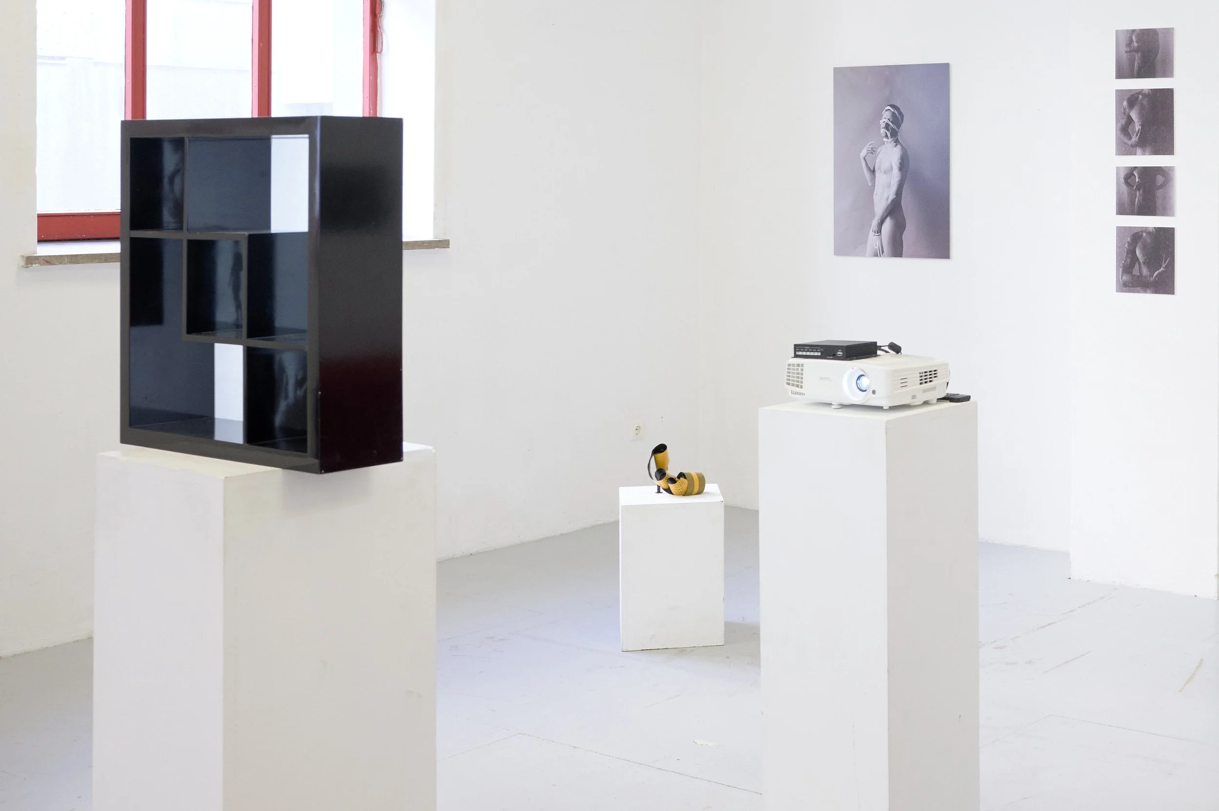    Acceptance  , 2023, 46 x 46 x 13 cm, wood, 120g paper backing, 3’05” video loop produced with still photographs 