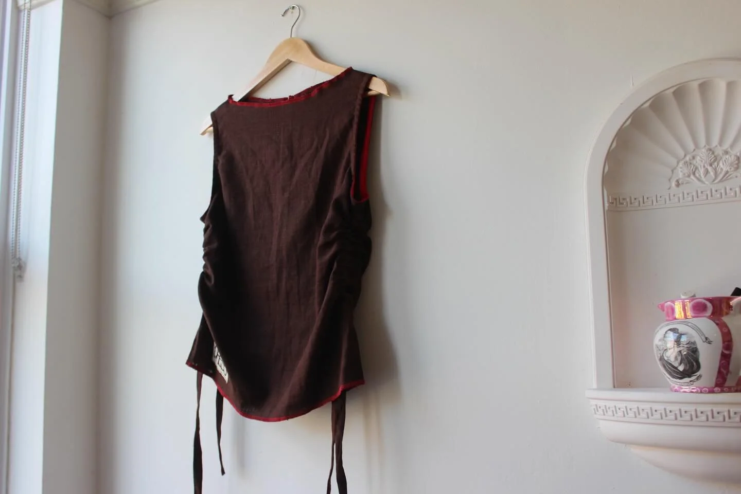 I have a selection of Ready To Wear pieces now listed on my website. There are a few one off pieces in recycled fabrics, and some available in various sizes. 

This brown linen singlet with a red trim is one of a kind and available in Small. For ques