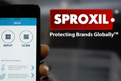 Smartphone screen displaying the Sprovil app with options to input data or scan, held by a person's hand. In the background is the Sprovil logo with the tagline 'Protecting Brands Globally.'