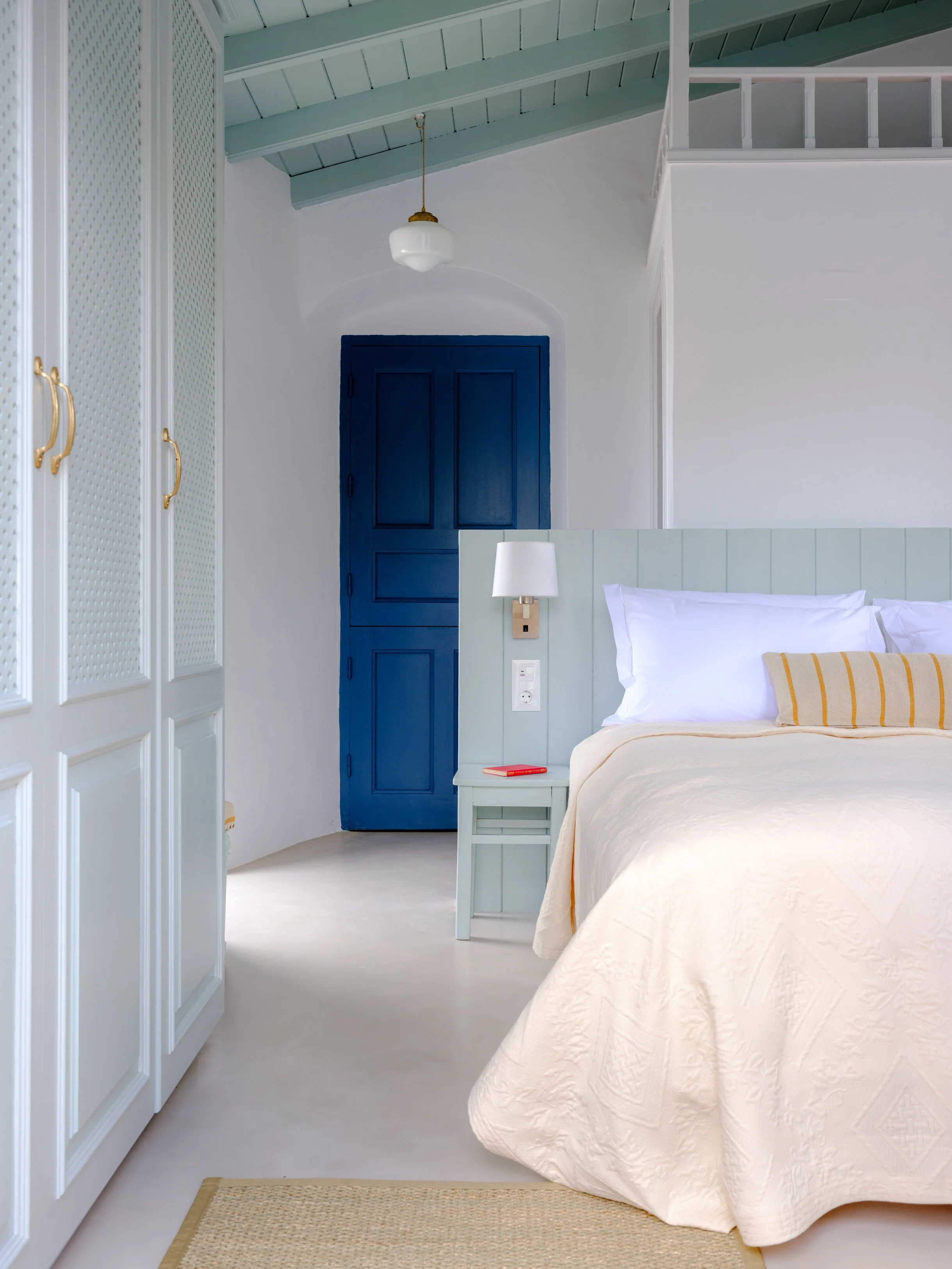 Eos suite bedroom at The Selene Greece, Symi, with balcony and sea view