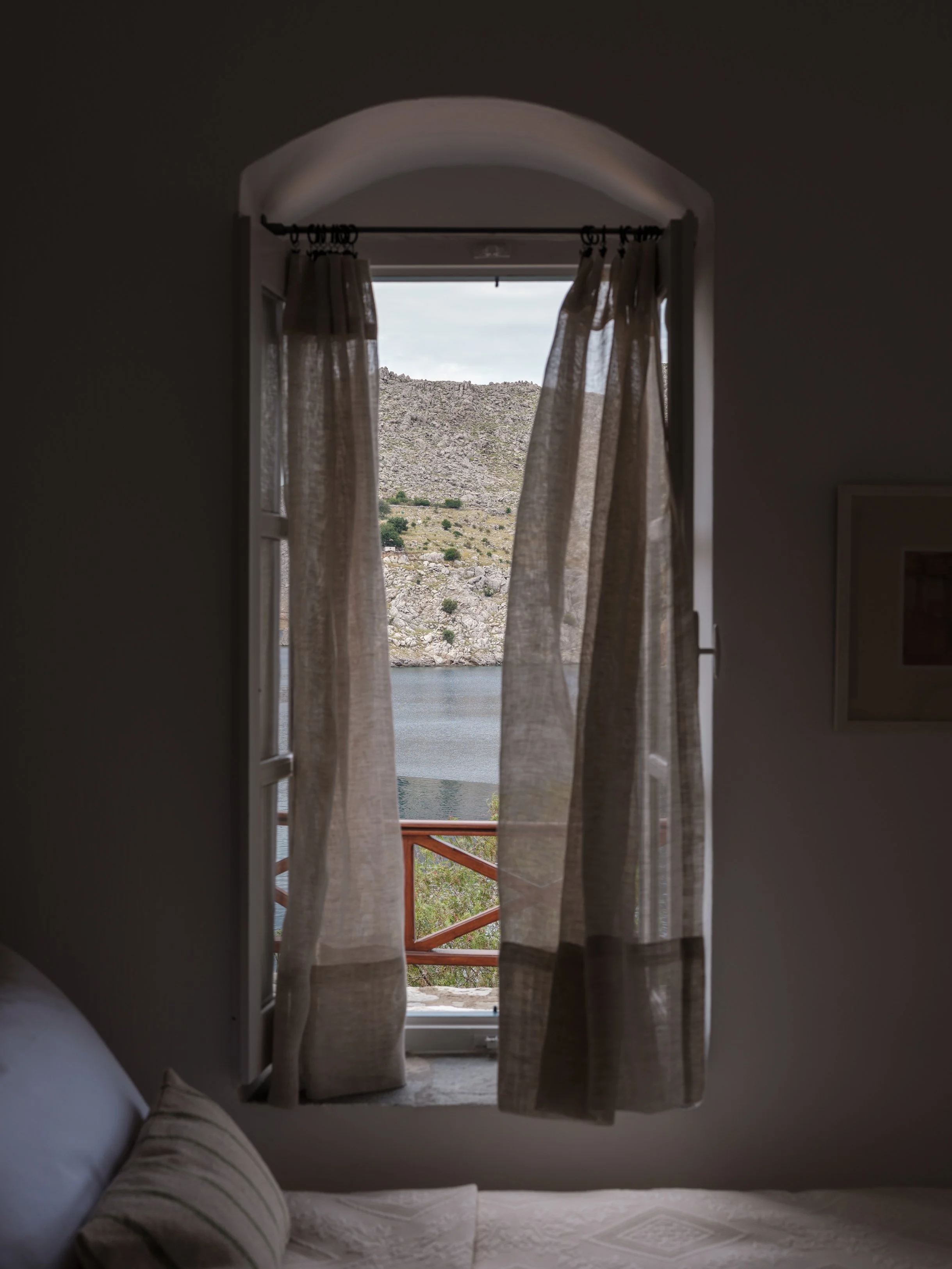 Thalassa suite bedroom 2 iron bed window with sea view at The Selene Greece, Symi