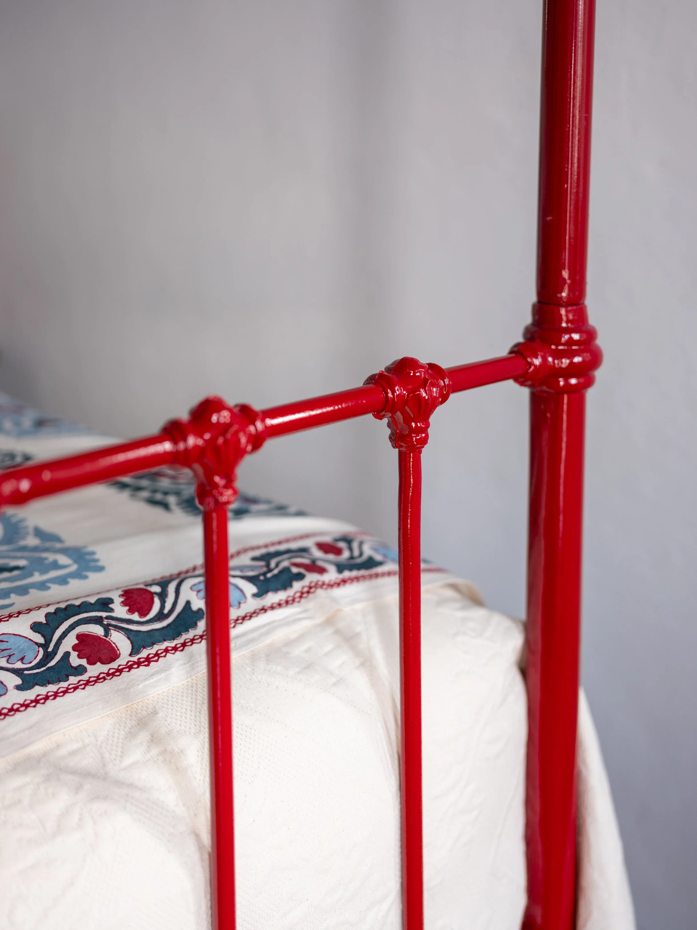 Thalassa suite bedroom 1 with four poster iron bed window and sea view terrace at The Selene Greece, Symi