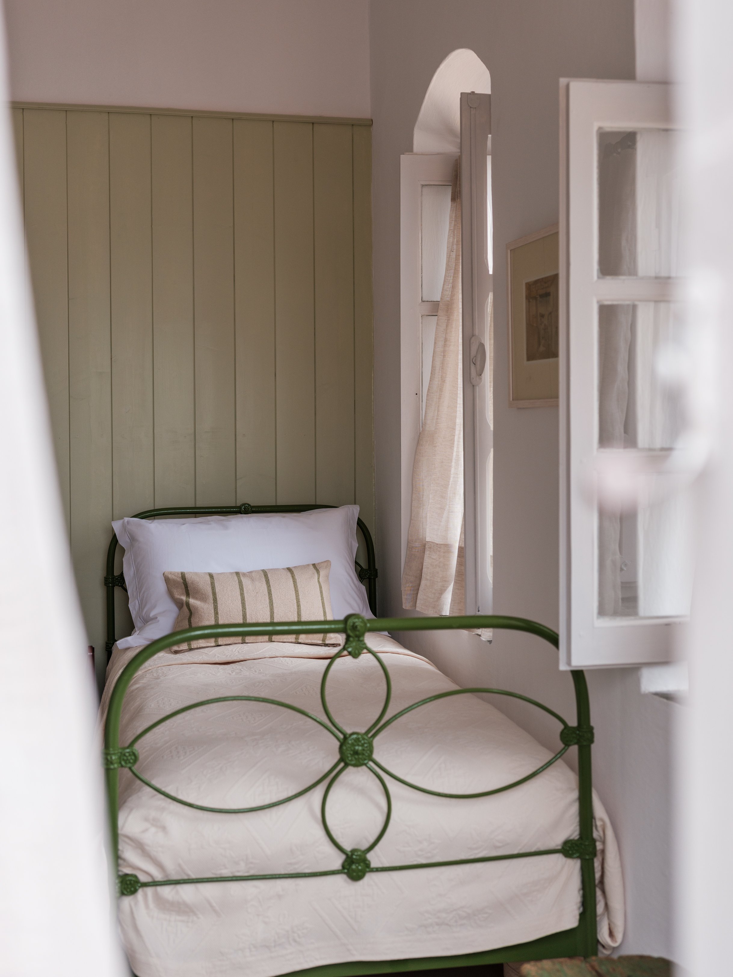 Thalassa suite bedroom 2 iron bed window with sea view at The Selene Greece, Symi