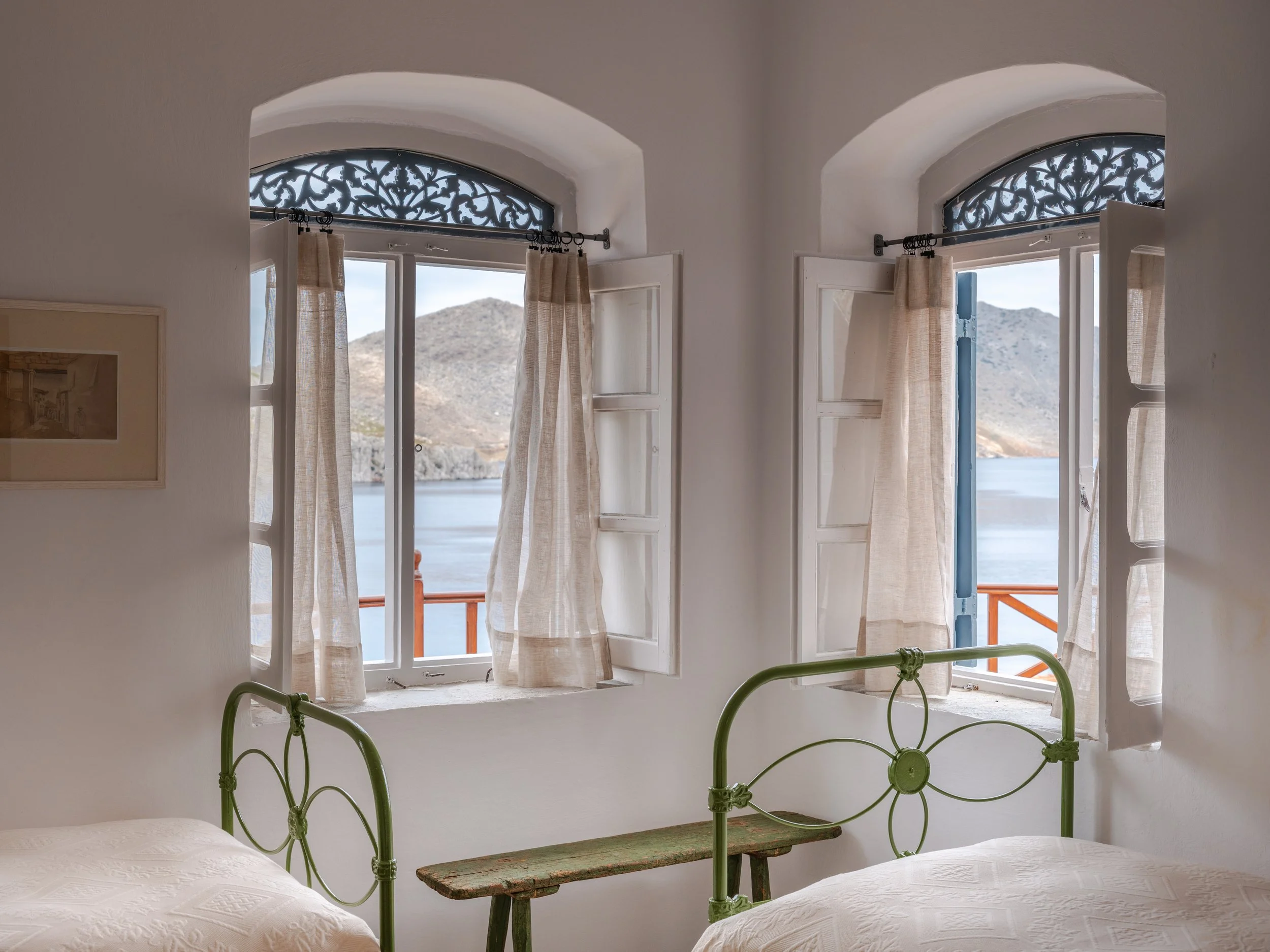 Thalassa suite bedroom 2 iron bed window with sea view at The Selene Greece, Symi