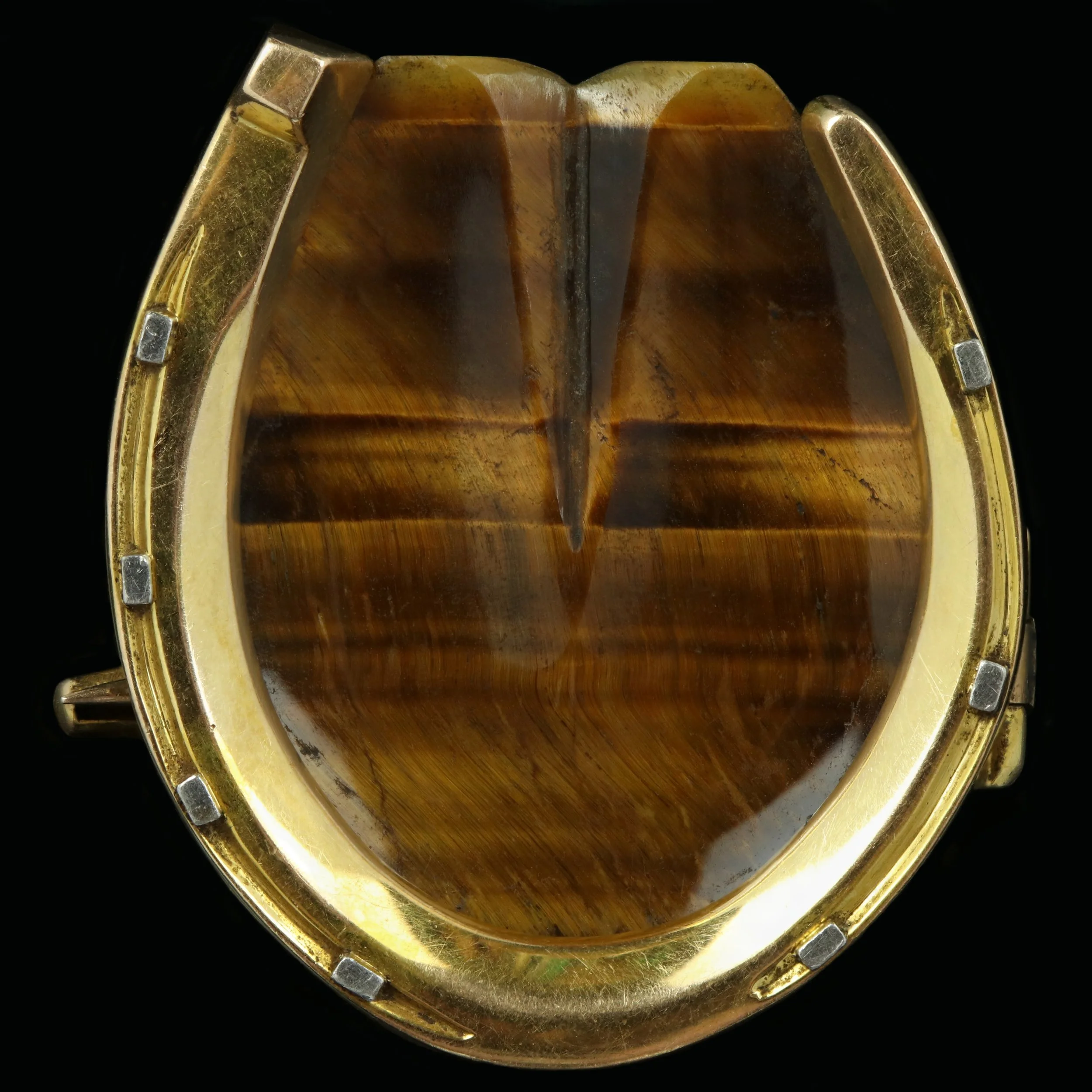 Early 20th century platinum and gold tiger’s-eye horseshoe brooch