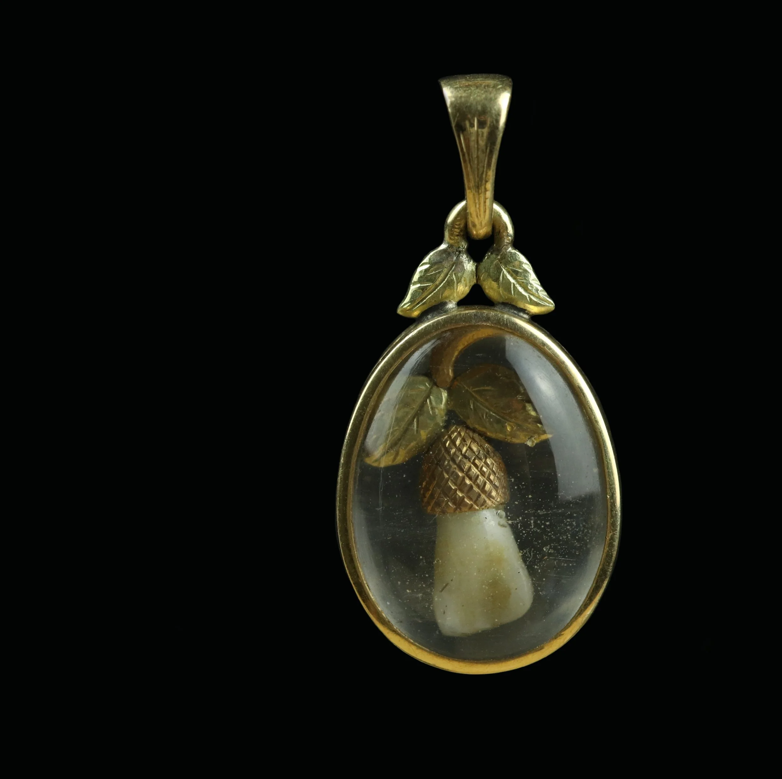 Antique gold baby tooth pendant