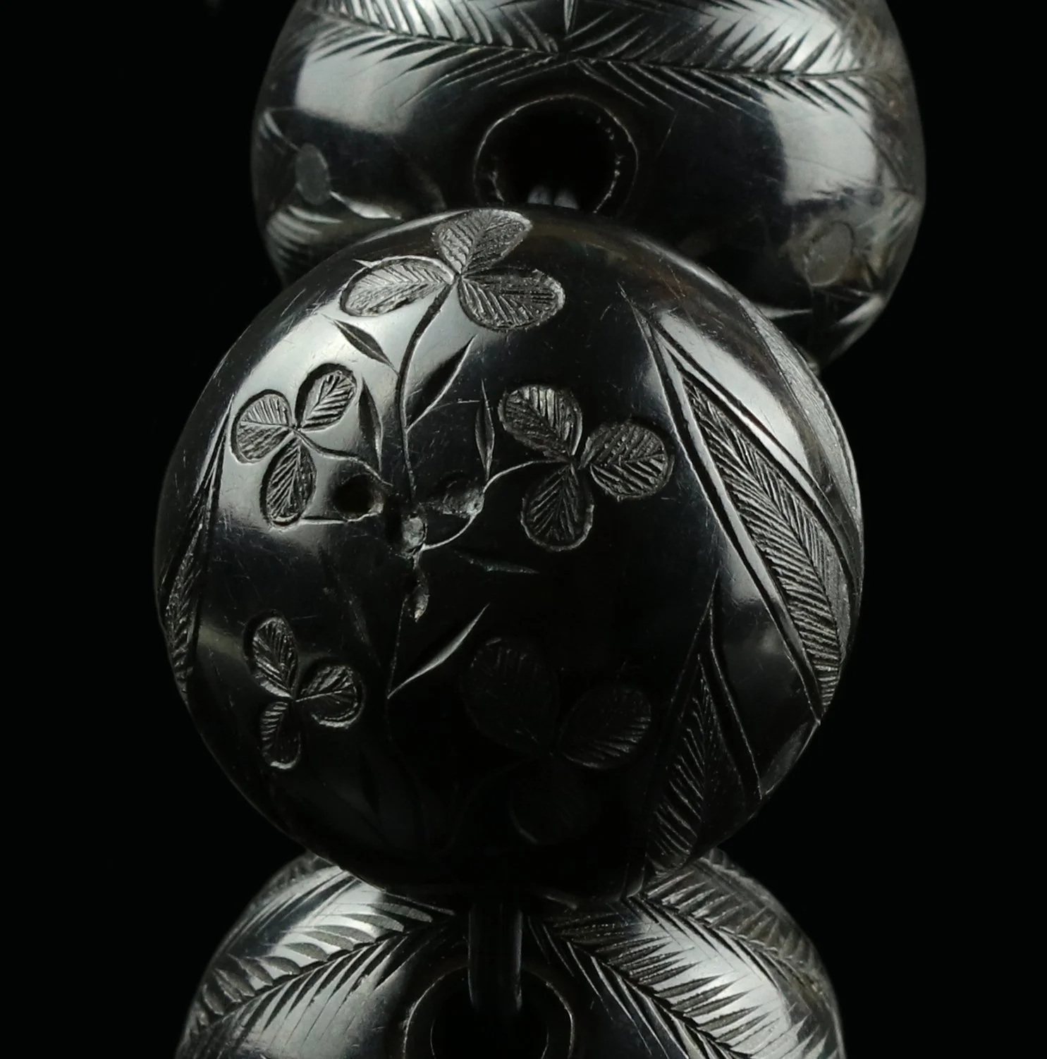 Carved Whitby jet and ebony beads
