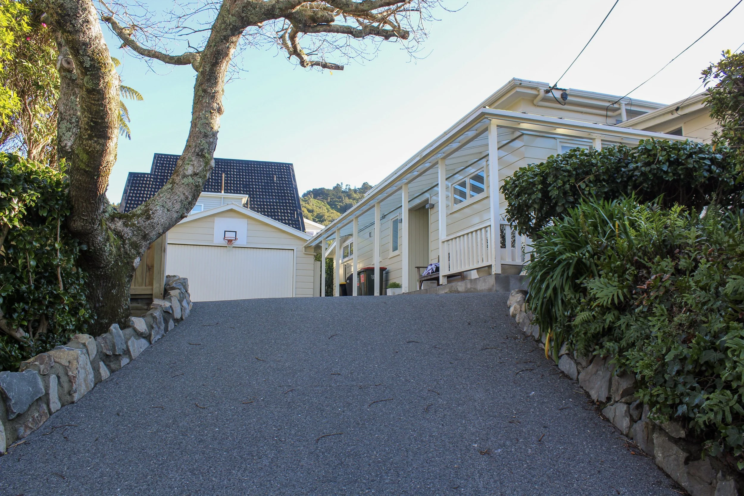 A new driveway provides a strong consistent look to the entry to the property, highlighting the house.