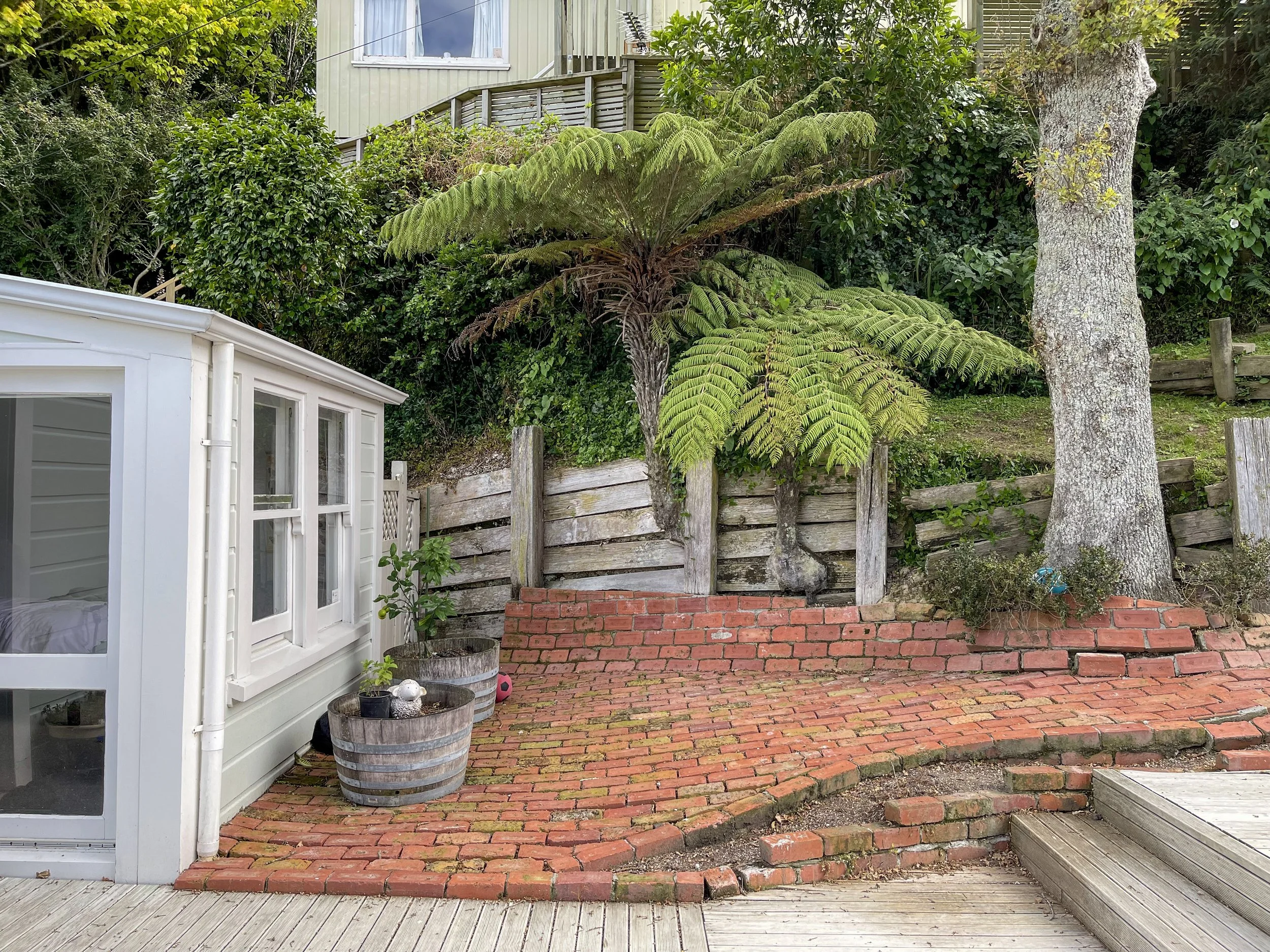 Highlighting the previous age of the brick - a very outdated path style that formed into the retaining walls.