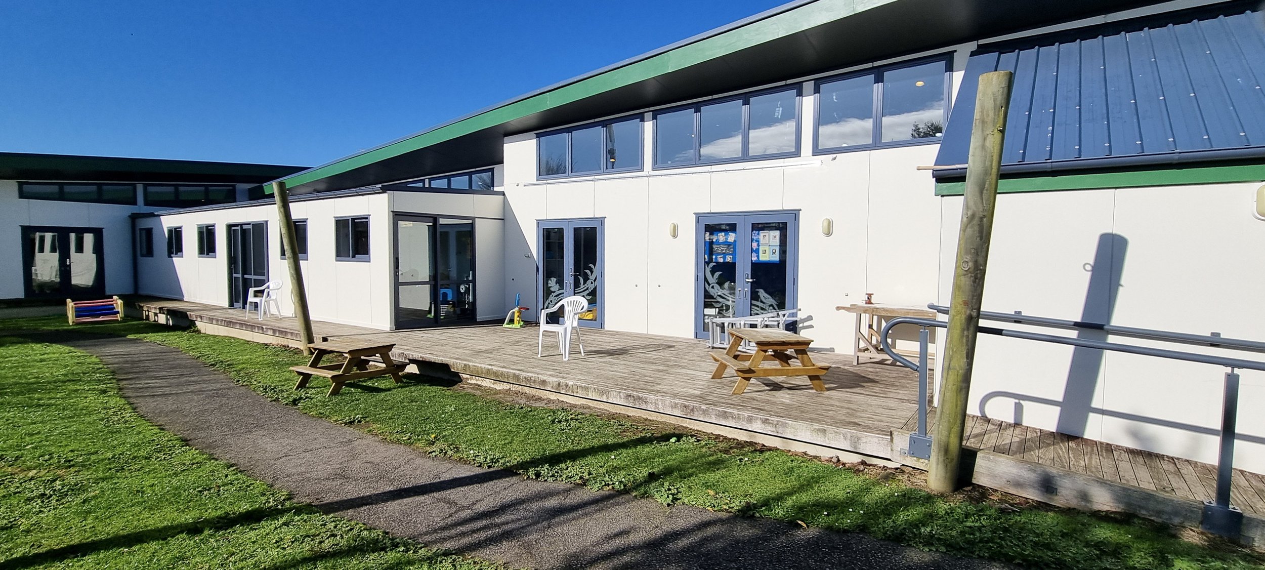 The existing decked space was open to all weather conditions. A priority was to change this.