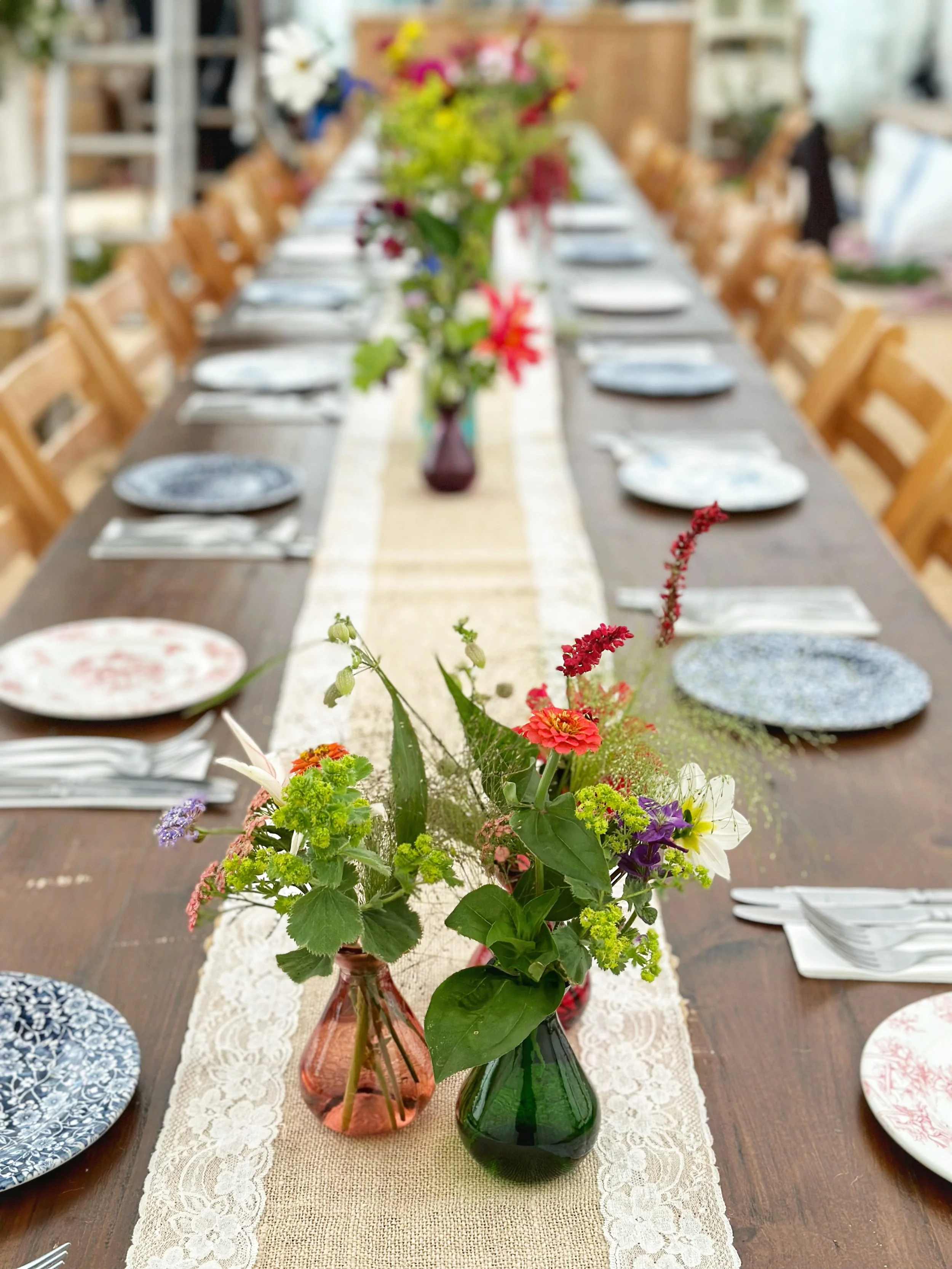Bud vases at a wedding party from Chippy Flower Farm.jpg